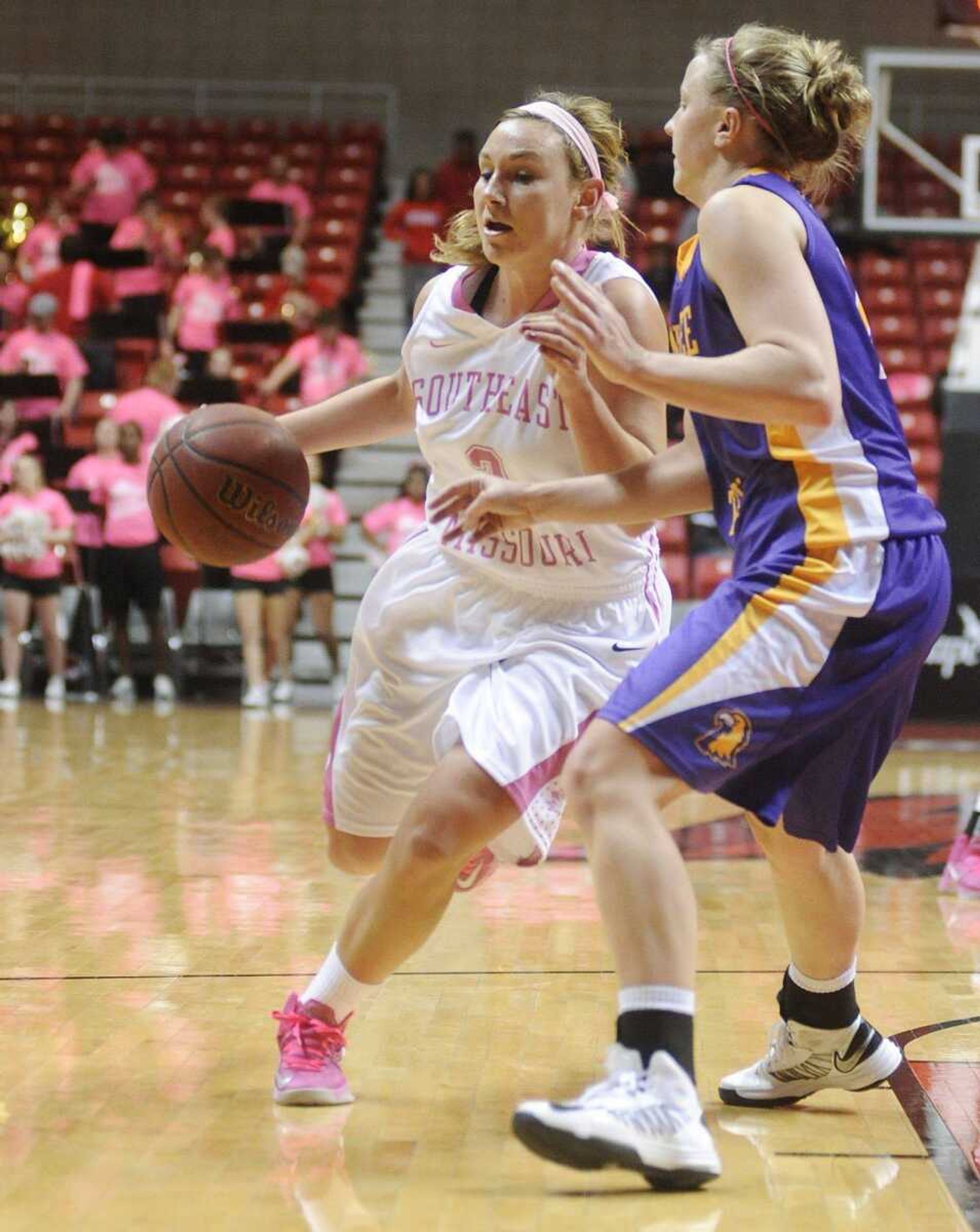 Southeast Missouri State guard Dru Haertling drives around Tennessee Tech guard Lashay Davis during the Redhawks' 64-51 loss to the Golden Eagles Monday, Feb. 25, at the Show Me Center. (ADAM VOGLER)