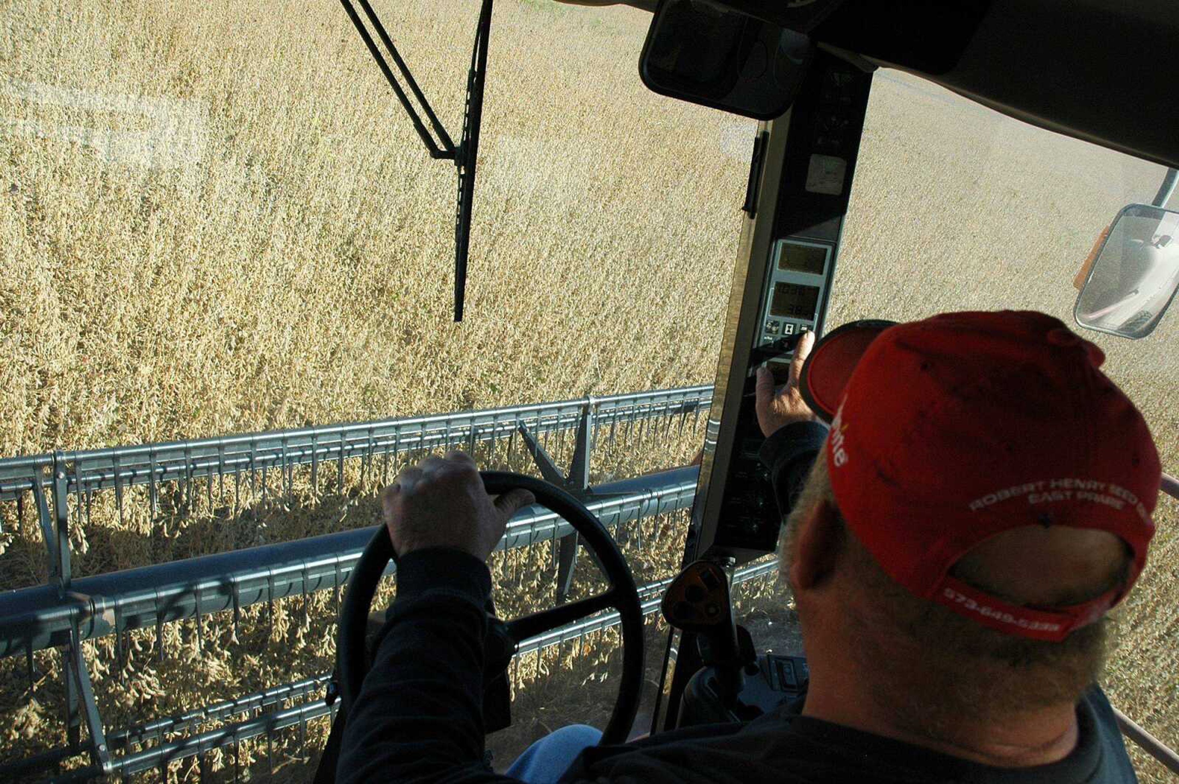 Steve Wright harvests soybeans Friday near Wyatt, Mo., in fields that had been covered with floodwaters after the intentional breach of the Birds Point levee in May. It took about two months for the waters to recede, and although soybeans were planted one to two months later than usual, the harvest season is now going smoothly in the floodway. (MELISSA MILLER)