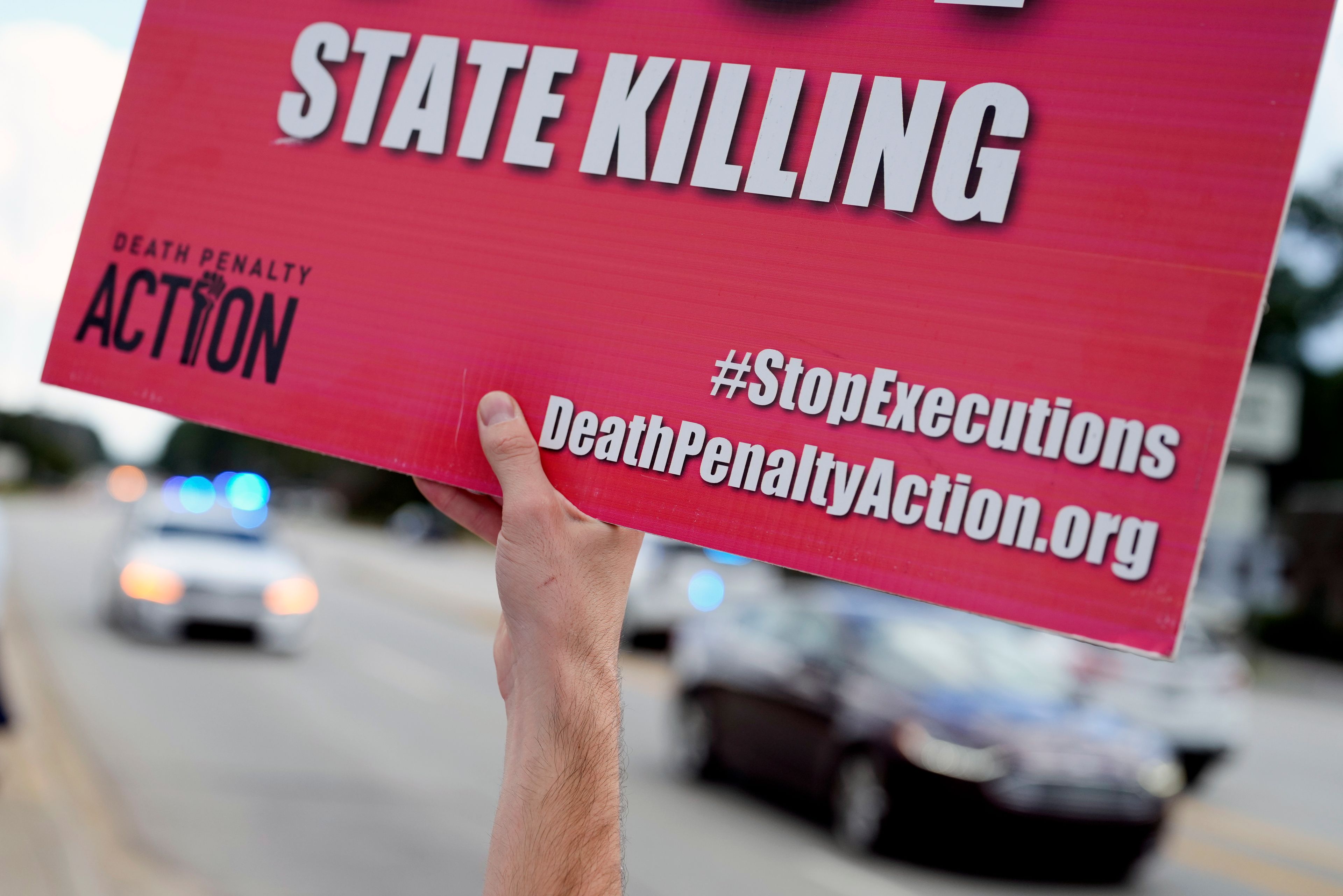 A demonstrators protests the planned execution of Freddie Eugene Owens, 46, on Friday, Sept. 20, 2024, in Columbia, S.C. Owens is set to be the first person to be executed in South Carolina in 13 years. (AP Photo/Chris Carlson)