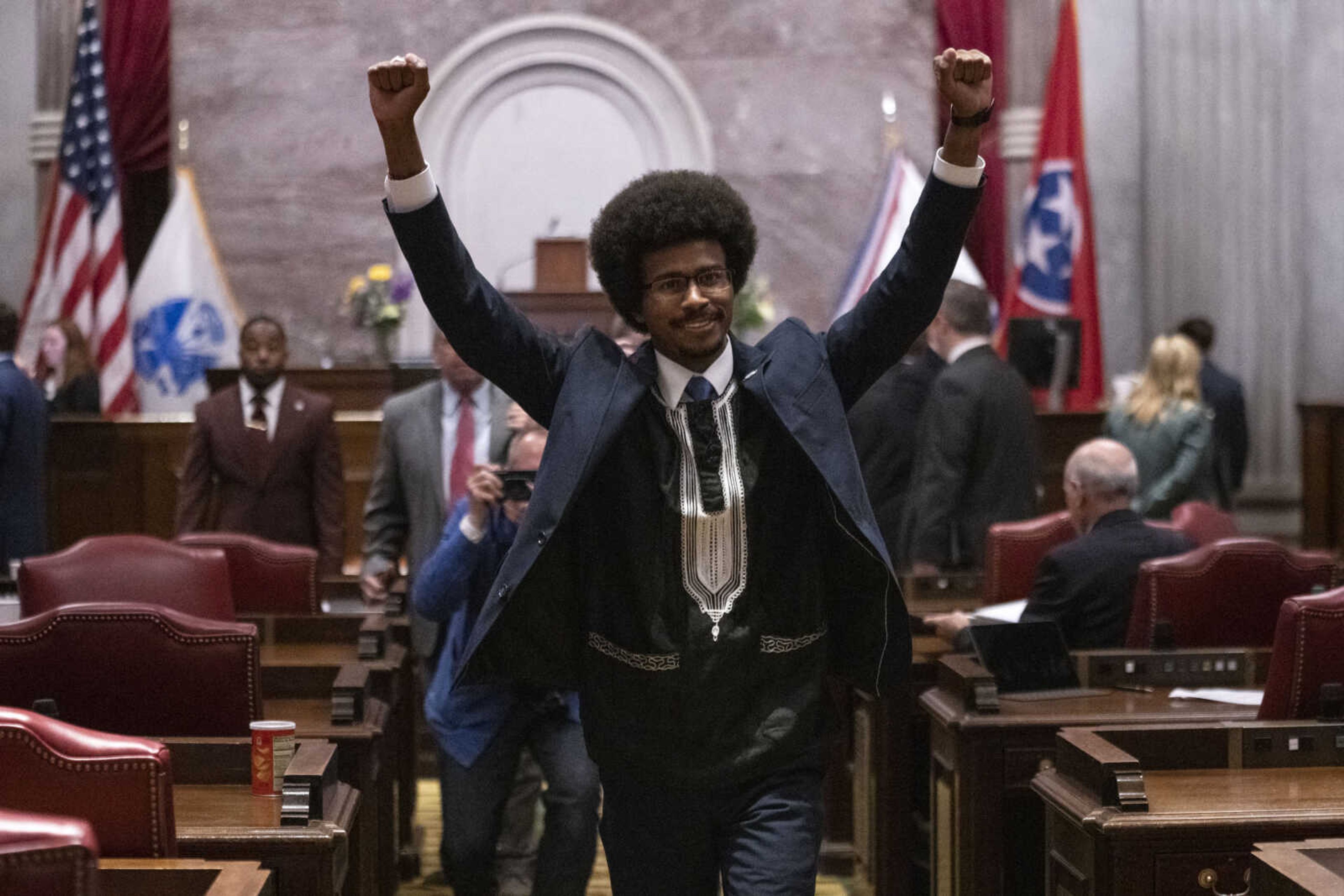 Former Rep. Justin Pearson, D-Memphis, raises his fists as he leaves the House chamber after he is expelled from the Legislature on Thursday in Nashville, Tennessee.