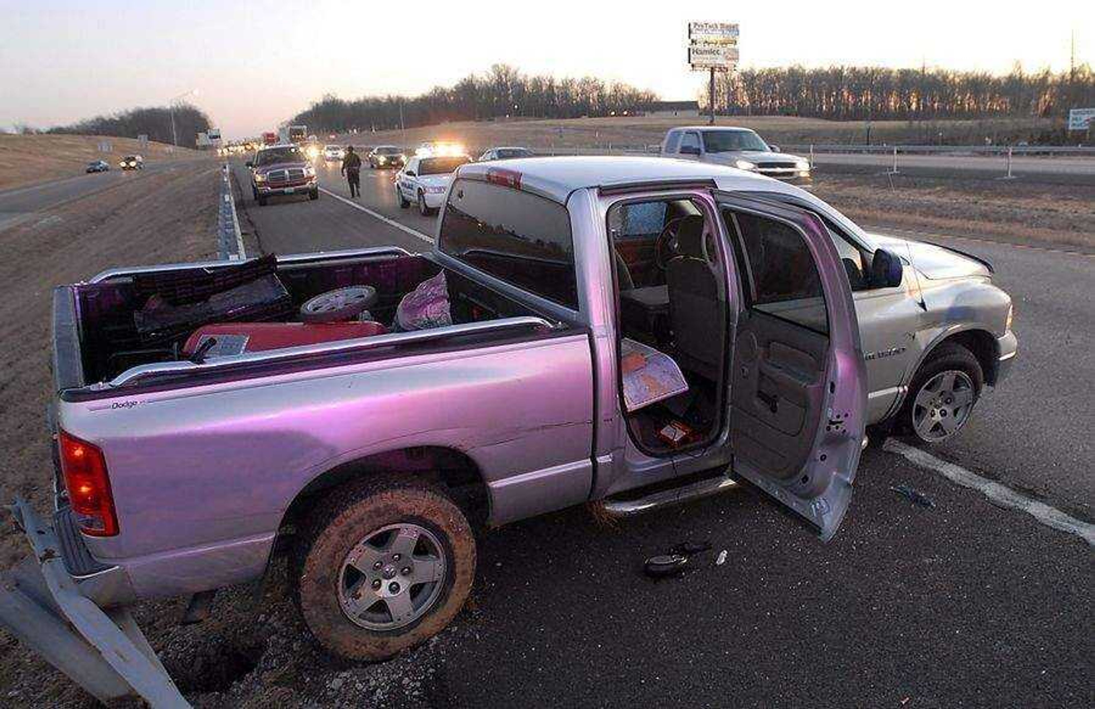 KIT DOYLE ~ kdoyle@semissourian.com<br>MIssouri State Highway Patrol and the Cape Girardeau Police Department coordinated efforts to stop a Dodge Ram involved in a high speed chase Tuesday evening, January 13, 2009, on Interstate 55.  The truck's front right tire was flattened with stop sticks and it came to rest against the guard rail near Center Junction.  The man fleeing is a suspect in a murder in Louisiana.