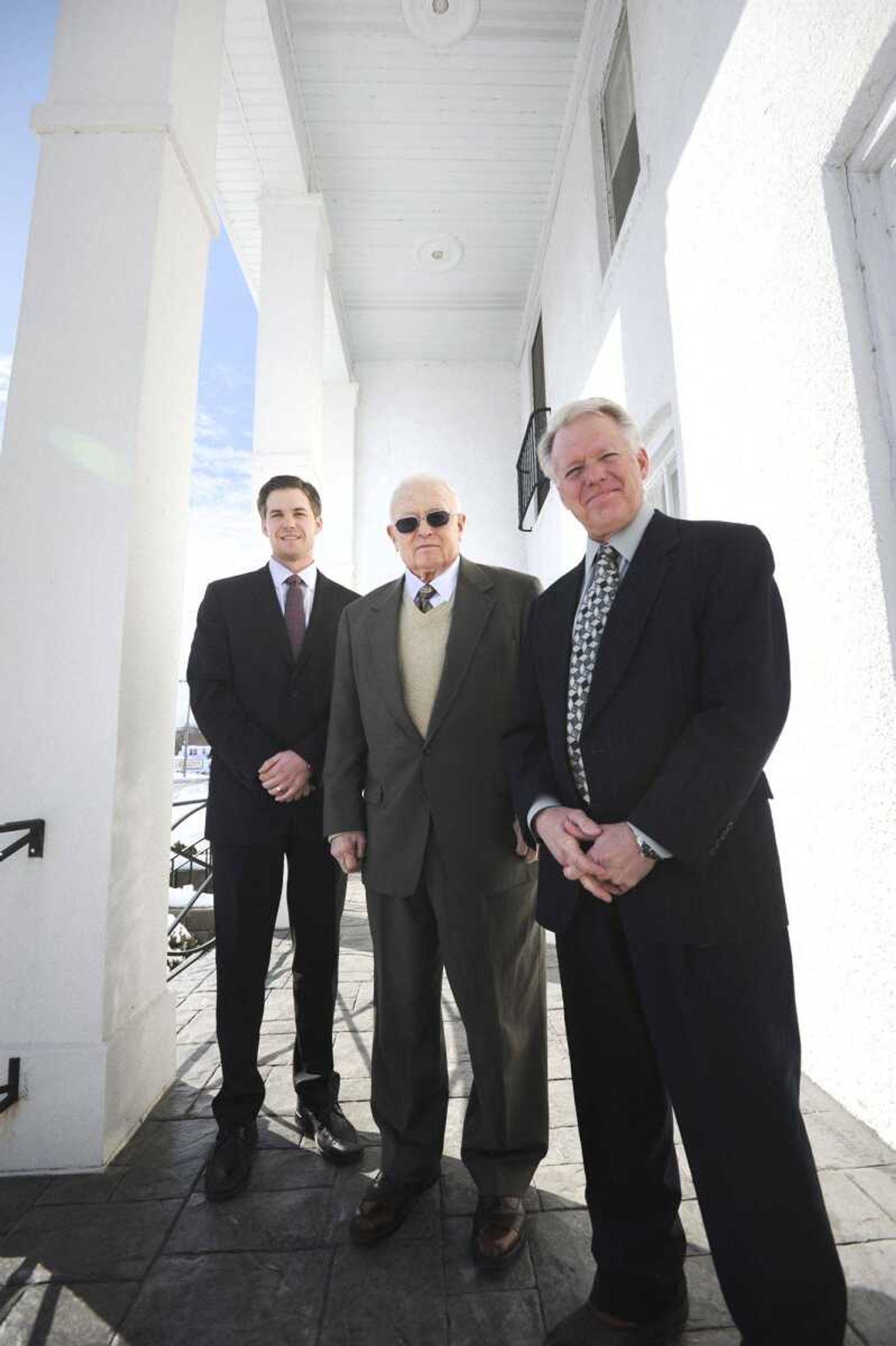 Cutline:Walter J. Ford, center, with his son Kevin Ford and grandson Josh Ford, in Jackson. (Laura Simon)