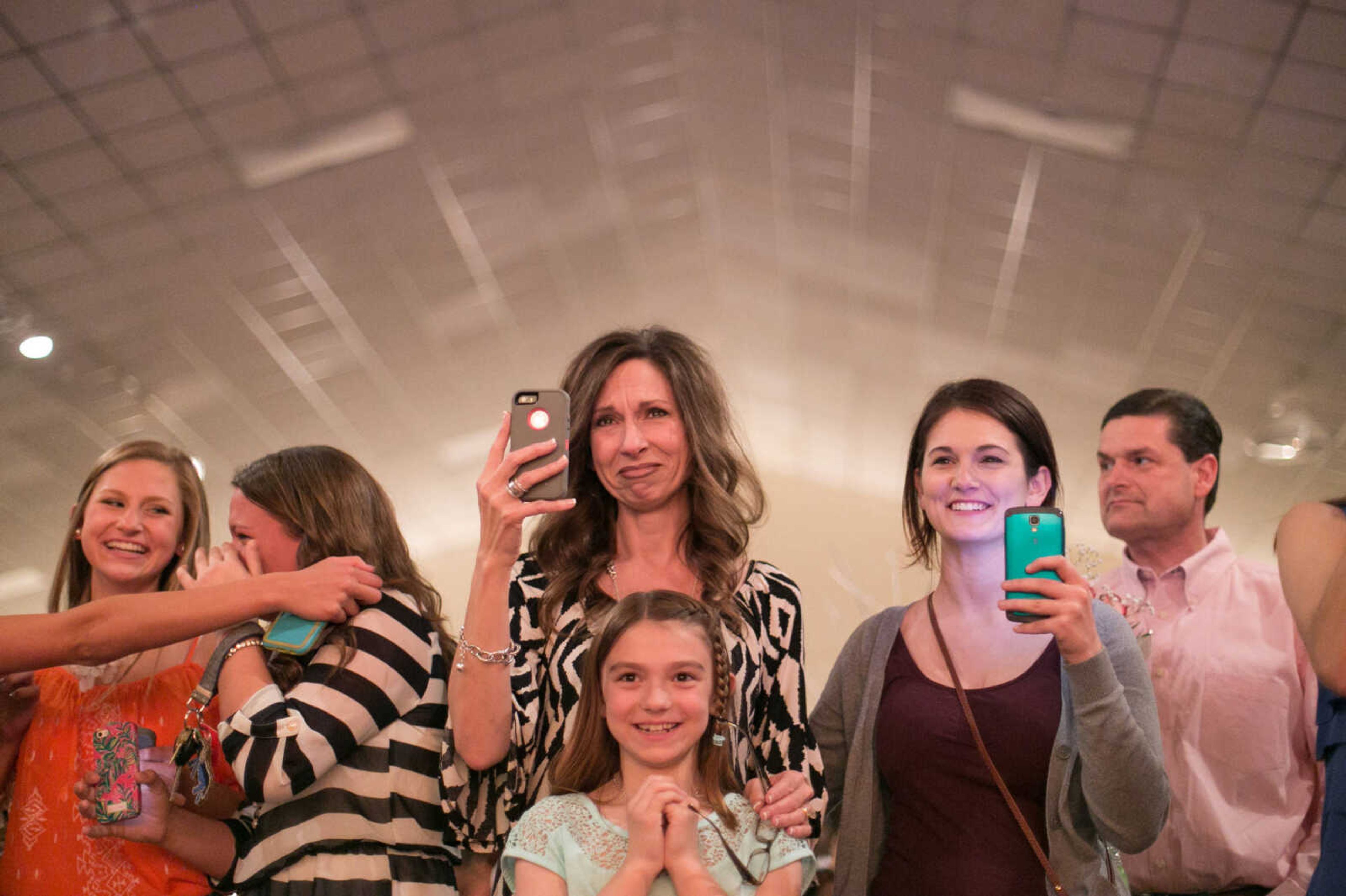 GLENN LANDBERG ~ glandberg@semissourian.com

Tamilla House, center watches the first dance after her daughter, Carley was crowned prom queen at the Cape Central High School prom Saturday April 25, 2015. Tamilla is joined by friends and family.