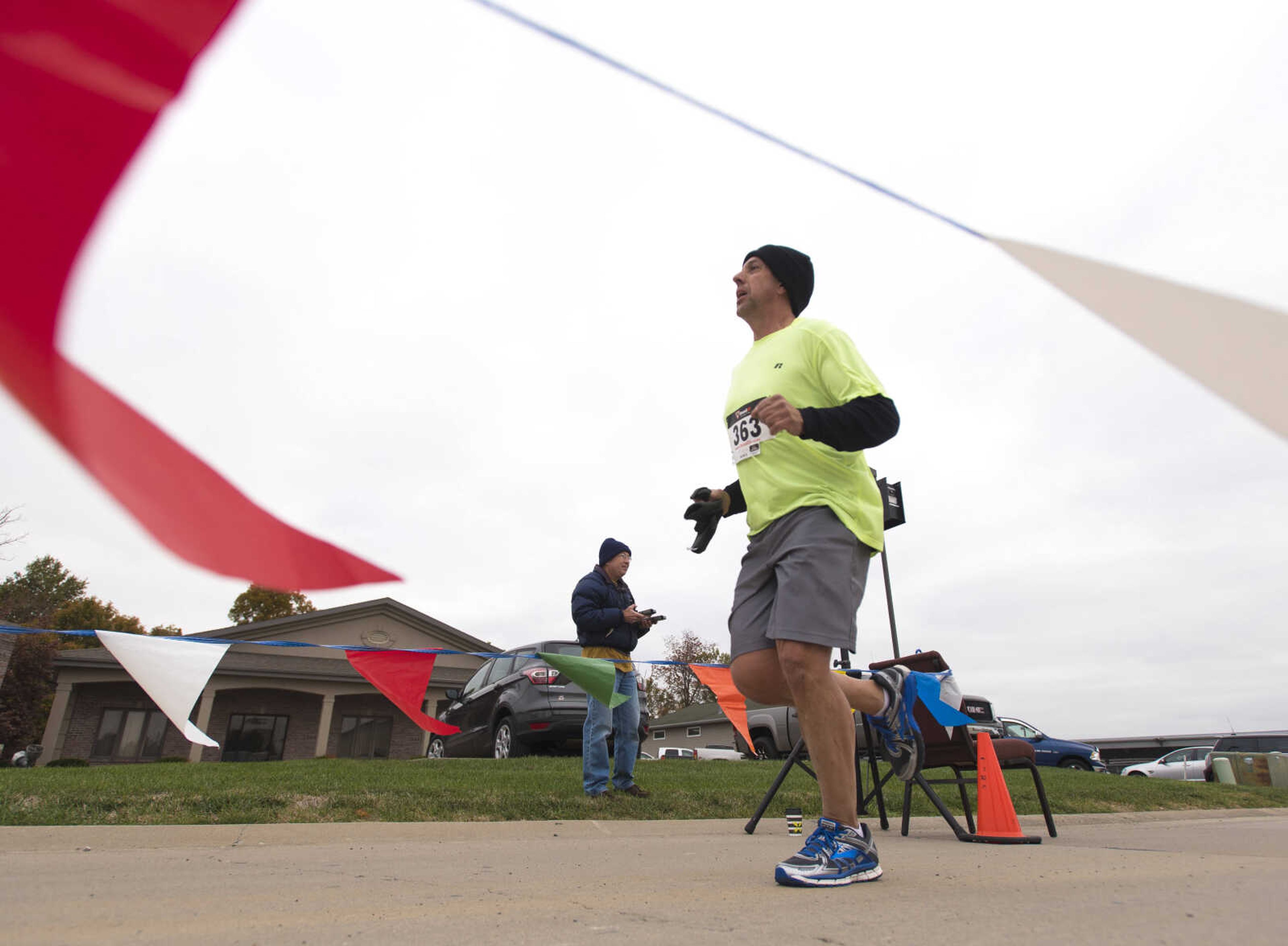 Jeff Cox is the first to cross the finish line during the first Ghost and Goblin Gallop 5k race to raise money for the Crossroads Backpack Fair on Saturday, Oct. 28, 2017 in Jackson.