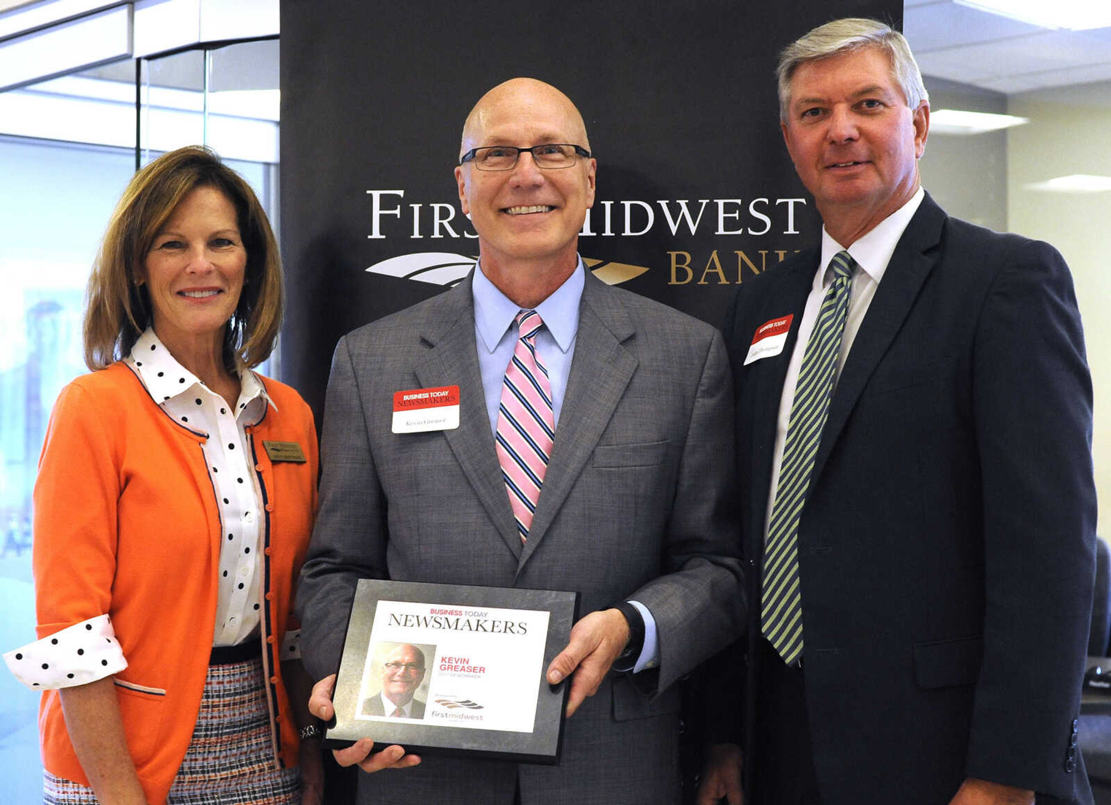 FRED LYNCH ~ flynch@semissourian.com
Kevin Greaser poses for a photo with Kathy Bertrand, First Midwest Bank community bank president, Cape Girardeau, and John N. Thompson, First Midwest Bank community bank president, Jackson, Wednesday, Sept. 6, 2017 during the Business Today Newsmakers awards reception at First Midwest Bank in Cape Girardeau.