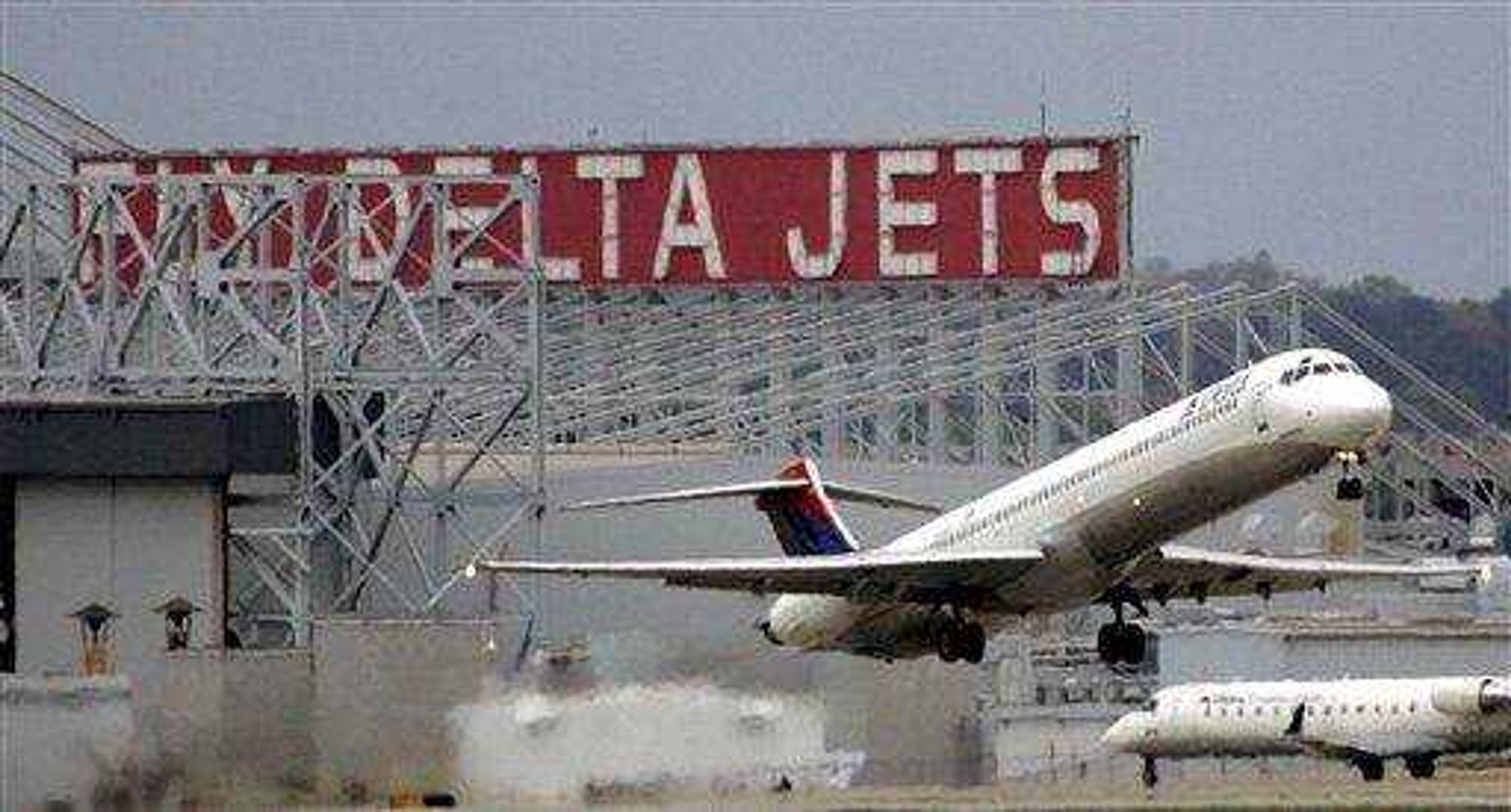 In this April 14, 2008 file photo, a Delta Airlines jet departs Hartsfield Jackson Atlanta International Airport in Atlanta. The airline reported a $257 million loss during the second quarter. (AP Photo/John Bazemore, file)