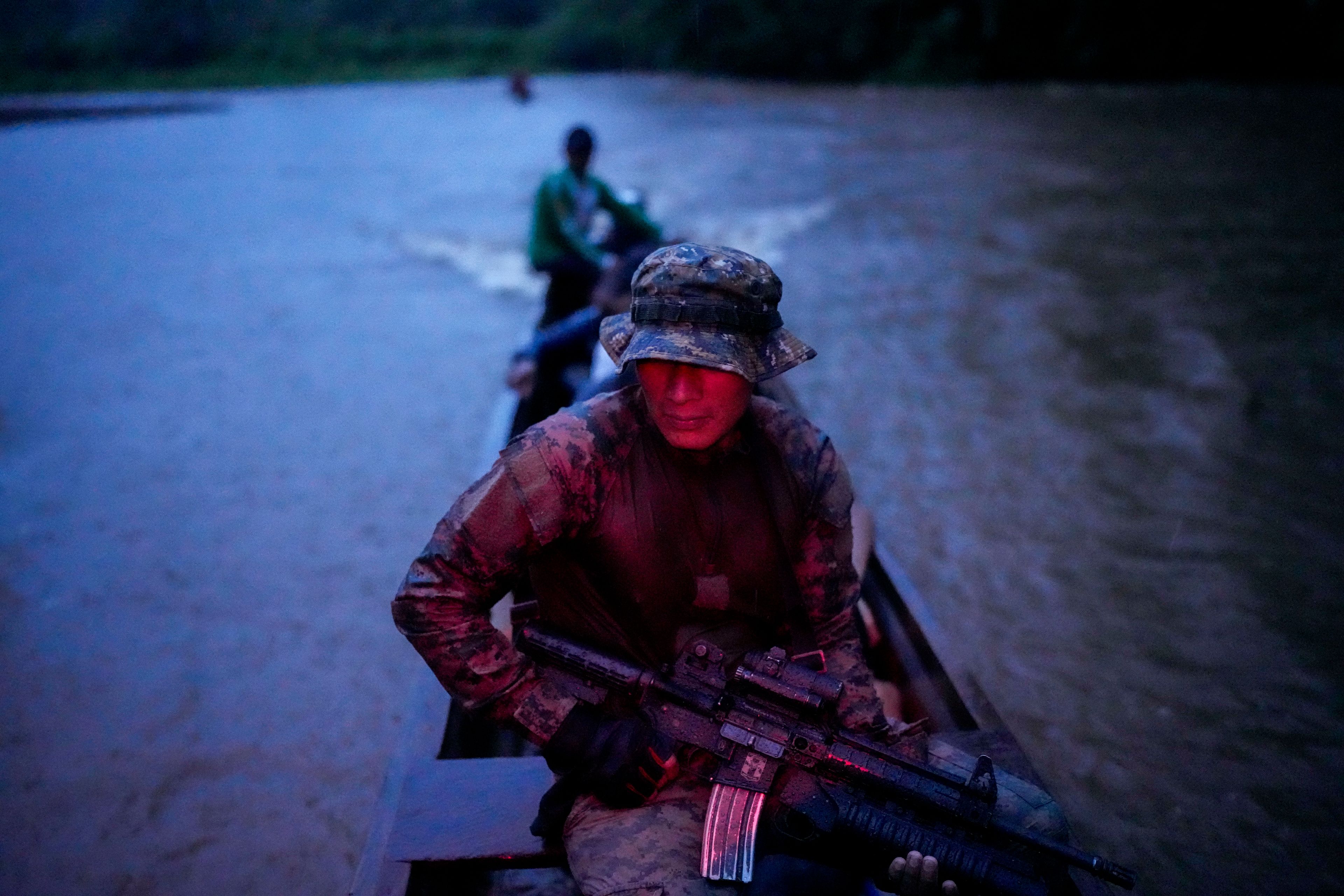 Panamanian border police patrol on the Tuquesa River near Bajo Chiquito, the village in Panama where migrants arrived after crossing the Darién Gap from Colombia en route to the United States, Friday, Nov. 8, 2024. (AP Photo/Matias Delacroix)