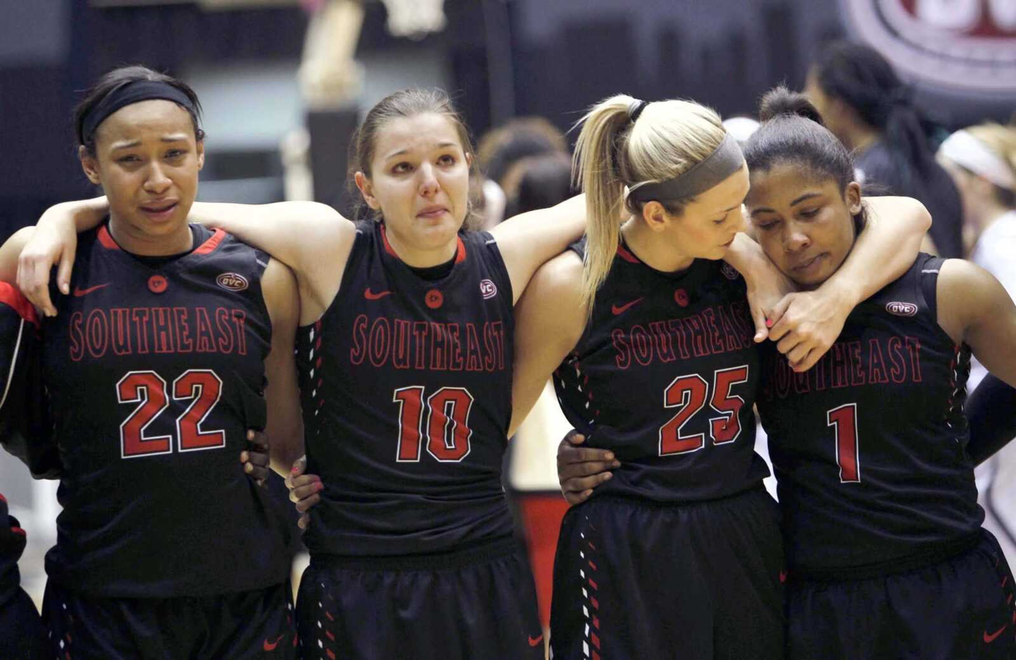 Southeast Missouri State players Deja Jones, left, Ashton Luttrull, Hannah Noe and Bri Mitchell join together after Thursday's 80-76 loss to SIU Edwardsville in the quarterfinal round of the OVC tournament in Nashville, Tennessee.