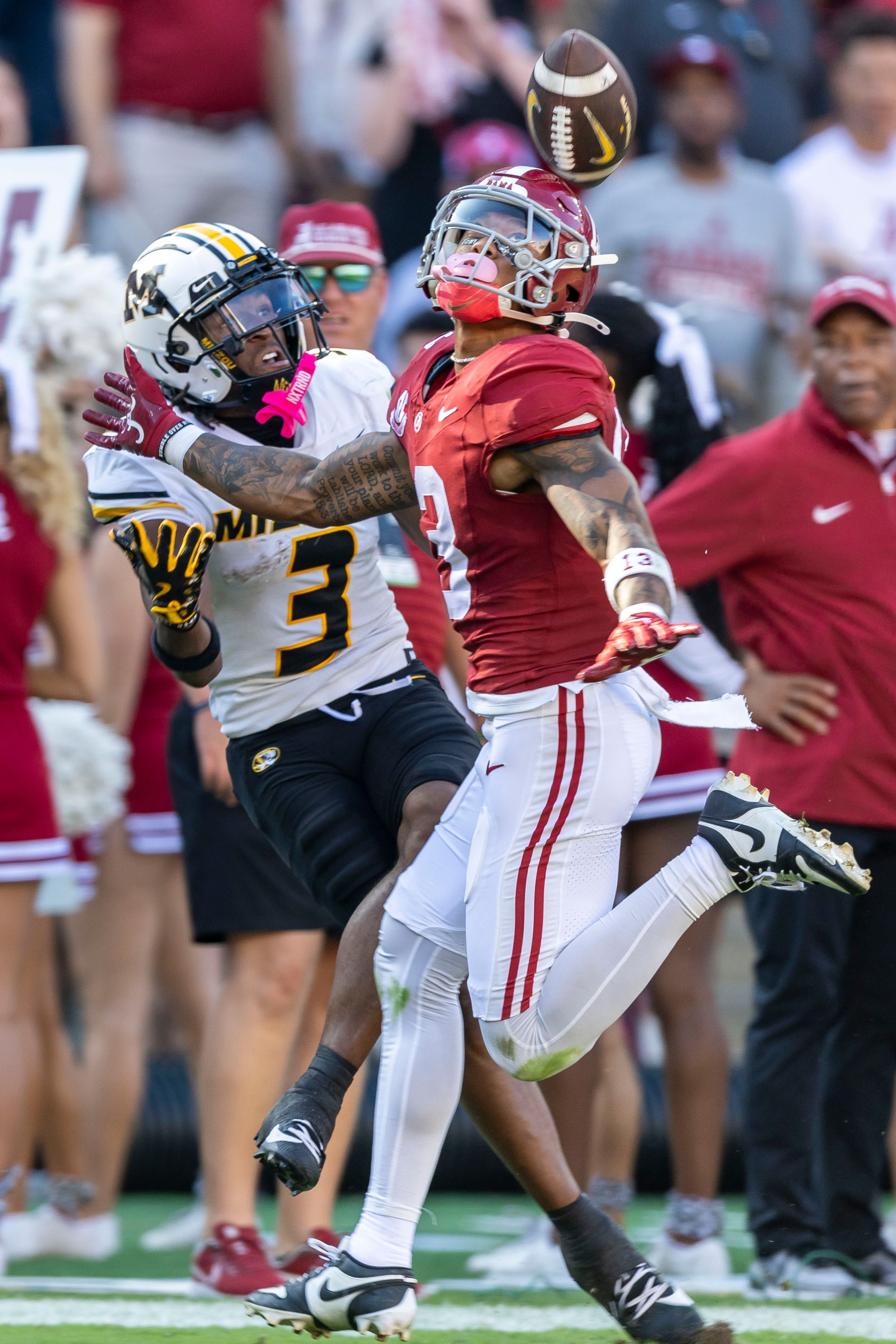 Alabama defensive back Keon Sabb, front right, defends a pass to Missouri wide receiver Luther Burden III, front left, during the first half of an NCAA college football game, Saturday, Oct. 26, 2024, in Tuscaloosa, Ala. (AP Photo/Vasha Hunt)