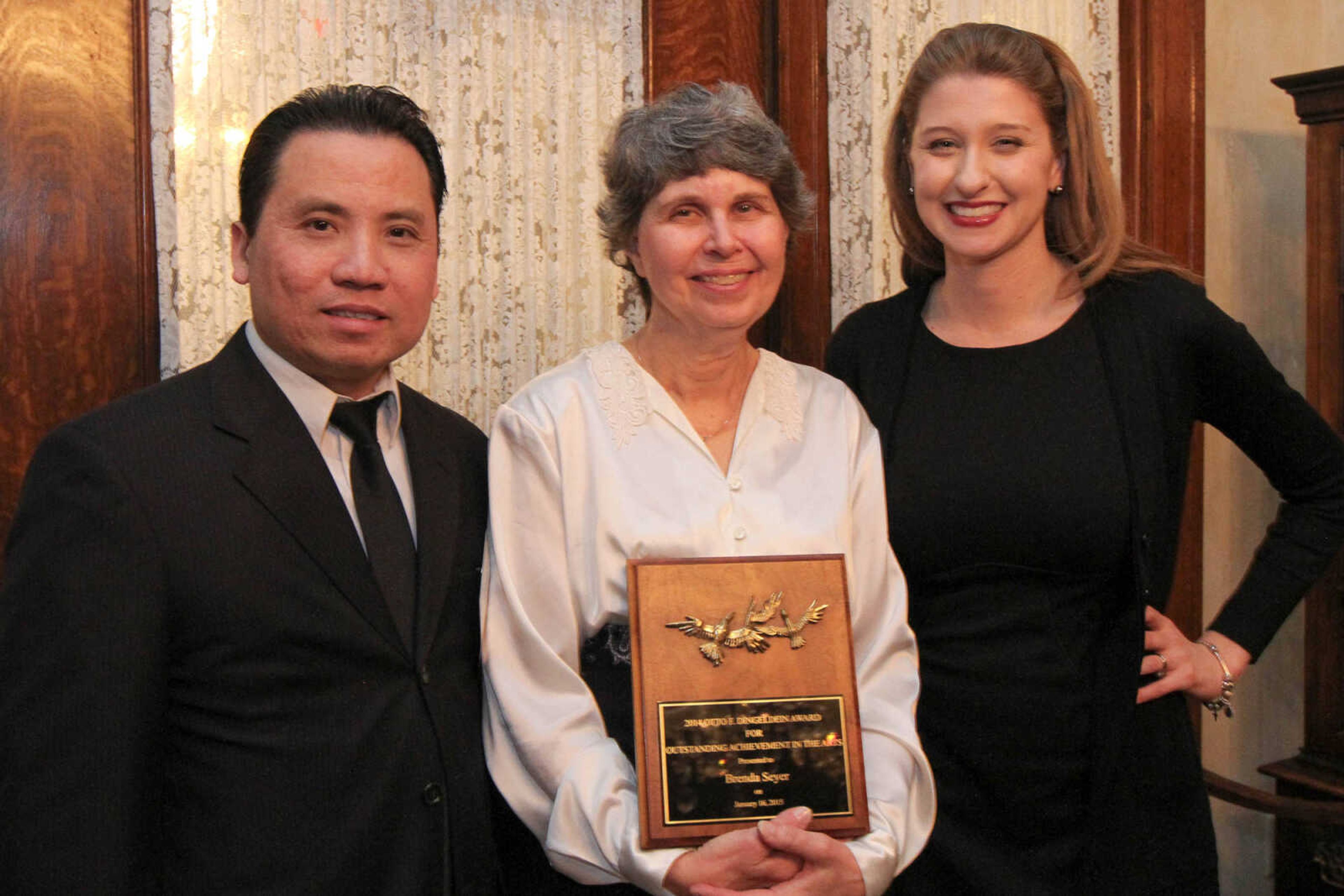 GLENN LANDBERG ~ glandberg@semissourian.com

Peter Nguyen and Murielle Gaither with the Arts Council of Southeast Missouri pose with Brenda S. Seyer, the 2014 winner of the Otto F. Dingeldein award.