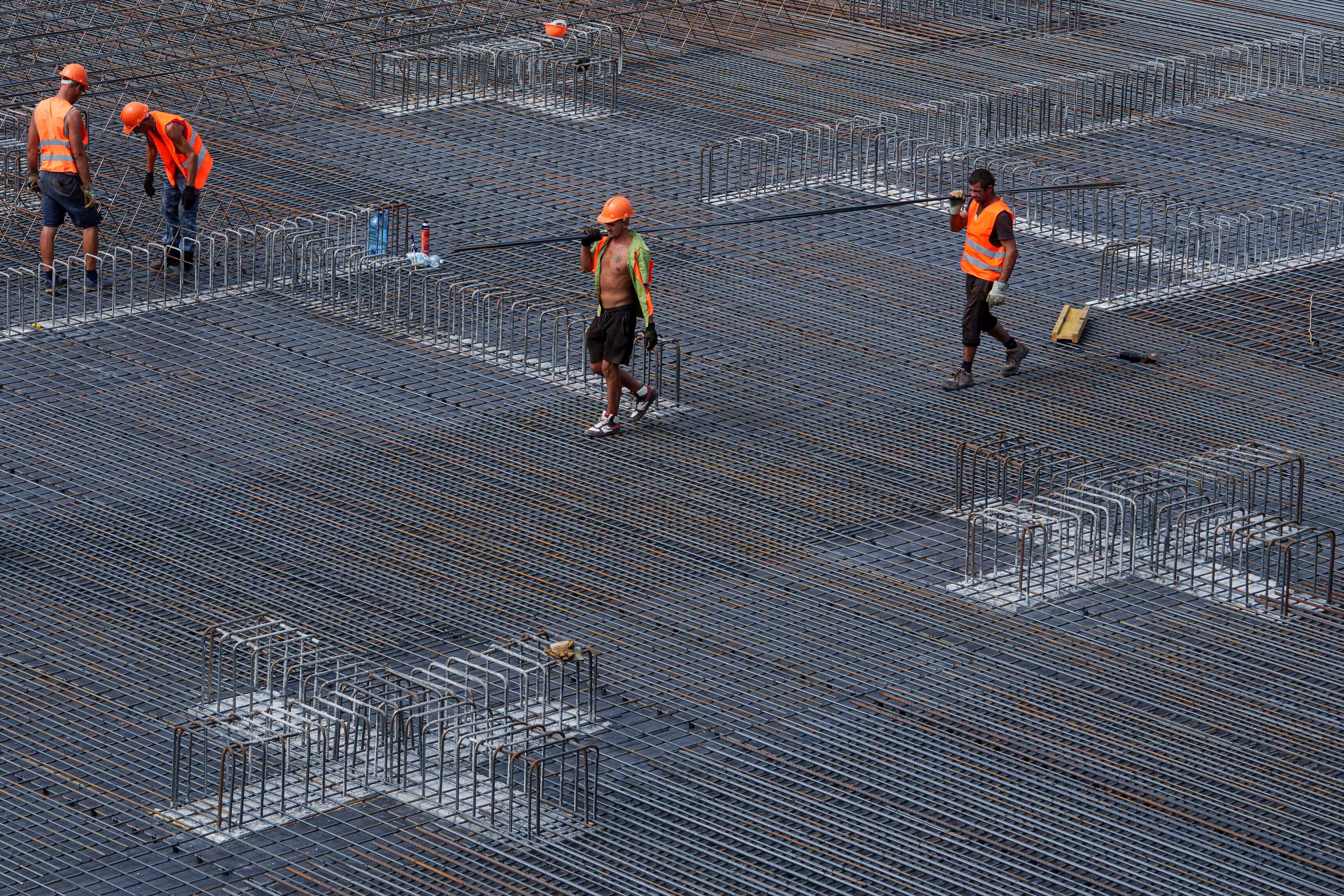 Builders work on the roof of the underground version of School No. 88, which is heavily fortified and designed to be radiation- and bomb-proof. The front-line city plans a dozen similar schools to allow education to continue in a war zone. (AP Photo/Evgeniy Maloletka)