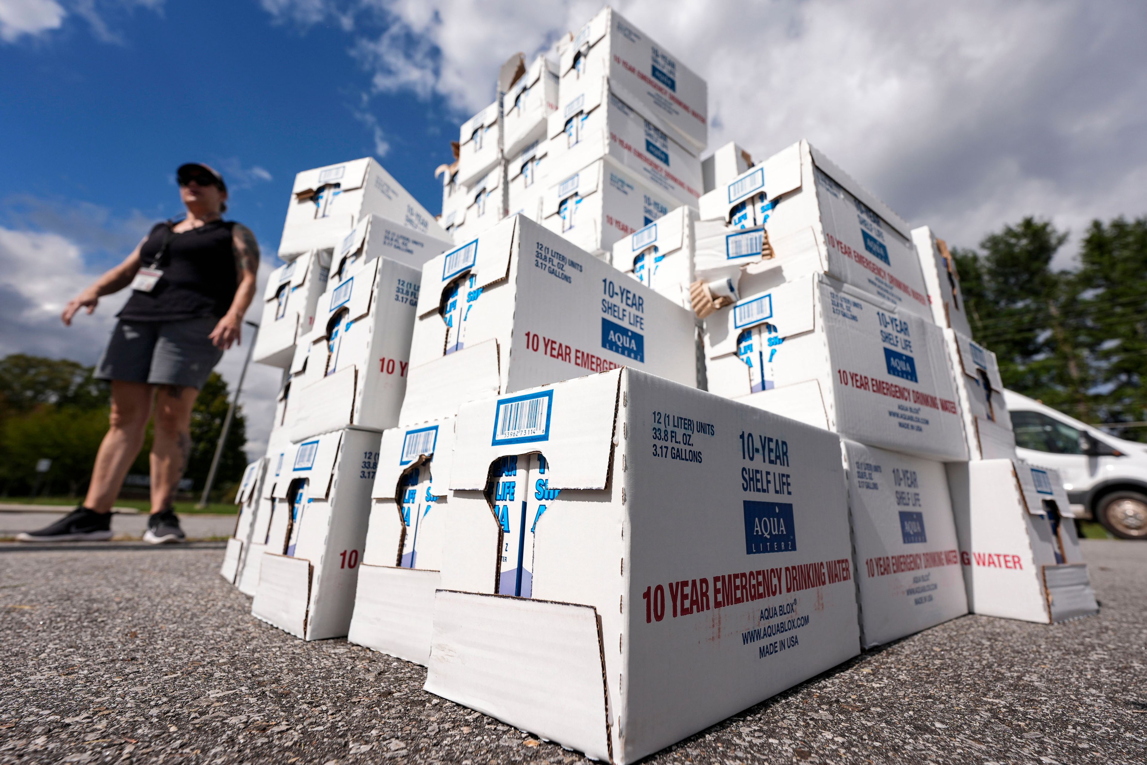 Volunteers stage water for citizens in the aftermath of Hurricane Helene, Monday, Sept. 30, 2024, in Asheville, N.C. (AP Photo/Mike Stewart)