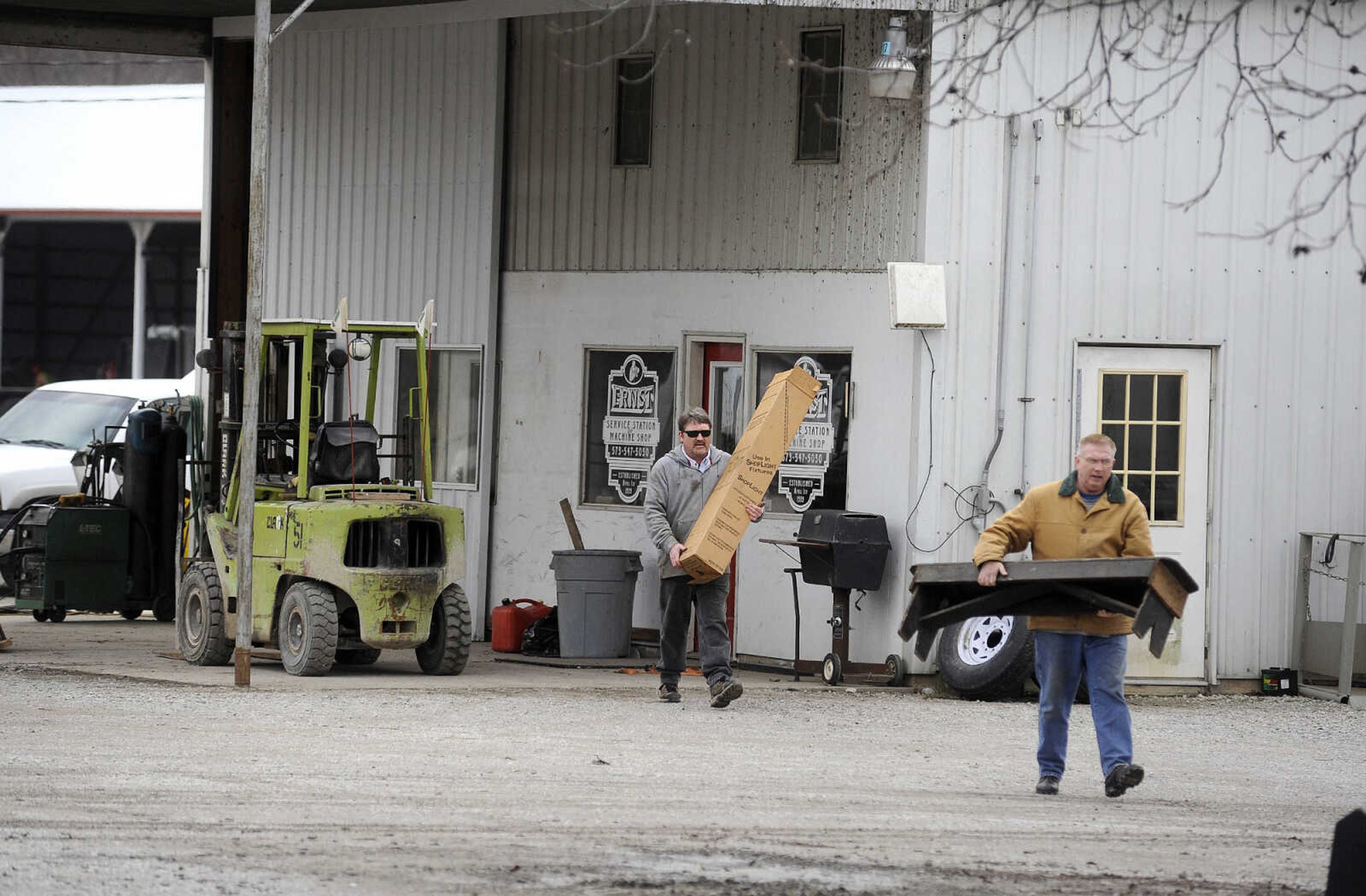 LAURA SIMON ~ lsimon@semissourian.com

Employees, friends and family help remove items from Ernst Service Station & Machine Shop to take to a higher location, Tuesday, Dec. 29, 2015, in McBride, Missouri.