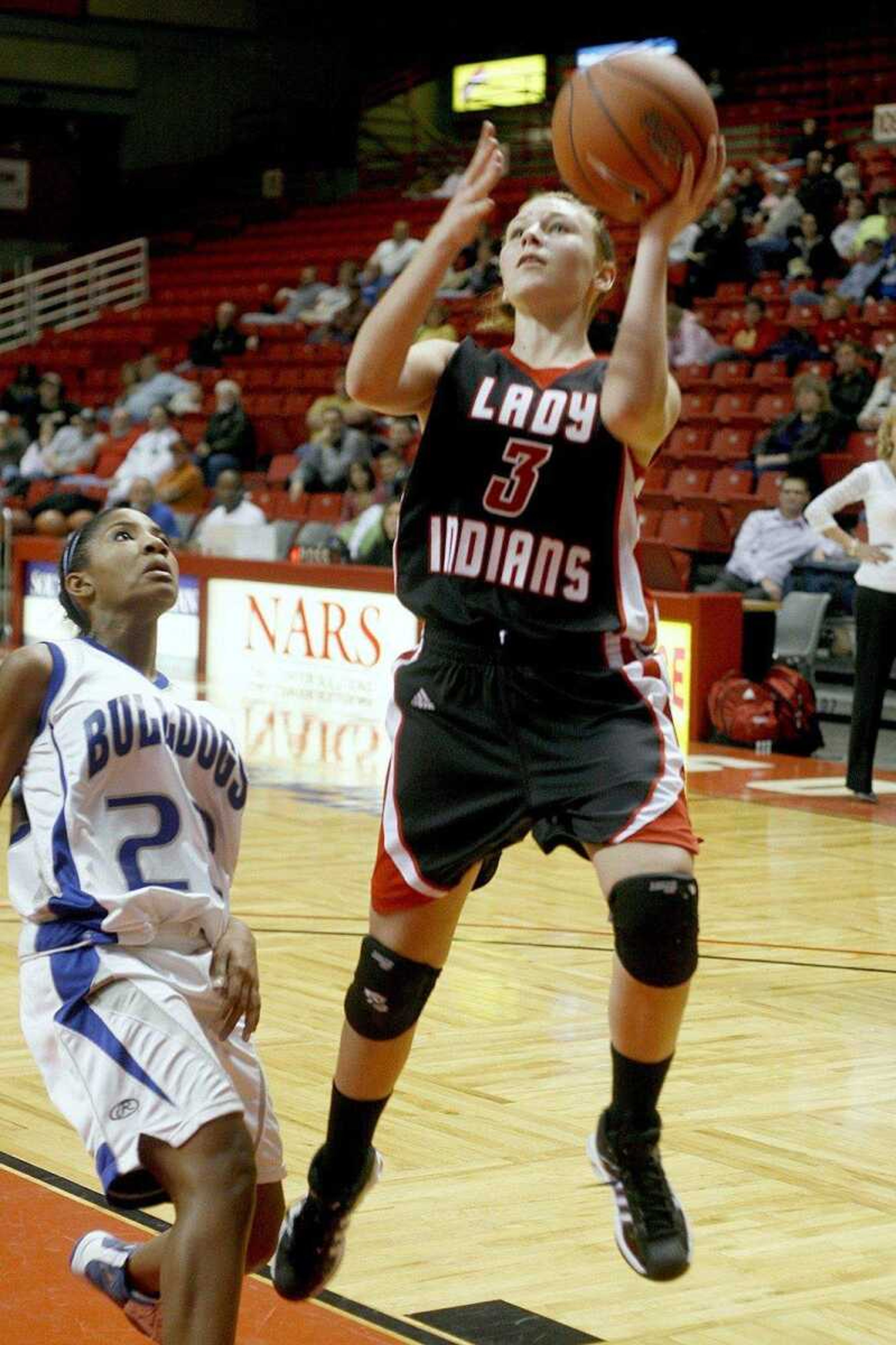 ELIZABETH DODD ~ edodd@semissourian.com
Jackson's Dru Haertling scores two points against Sparta's Jessica Robinson in the second half of a last second Jackson victory 35-34.