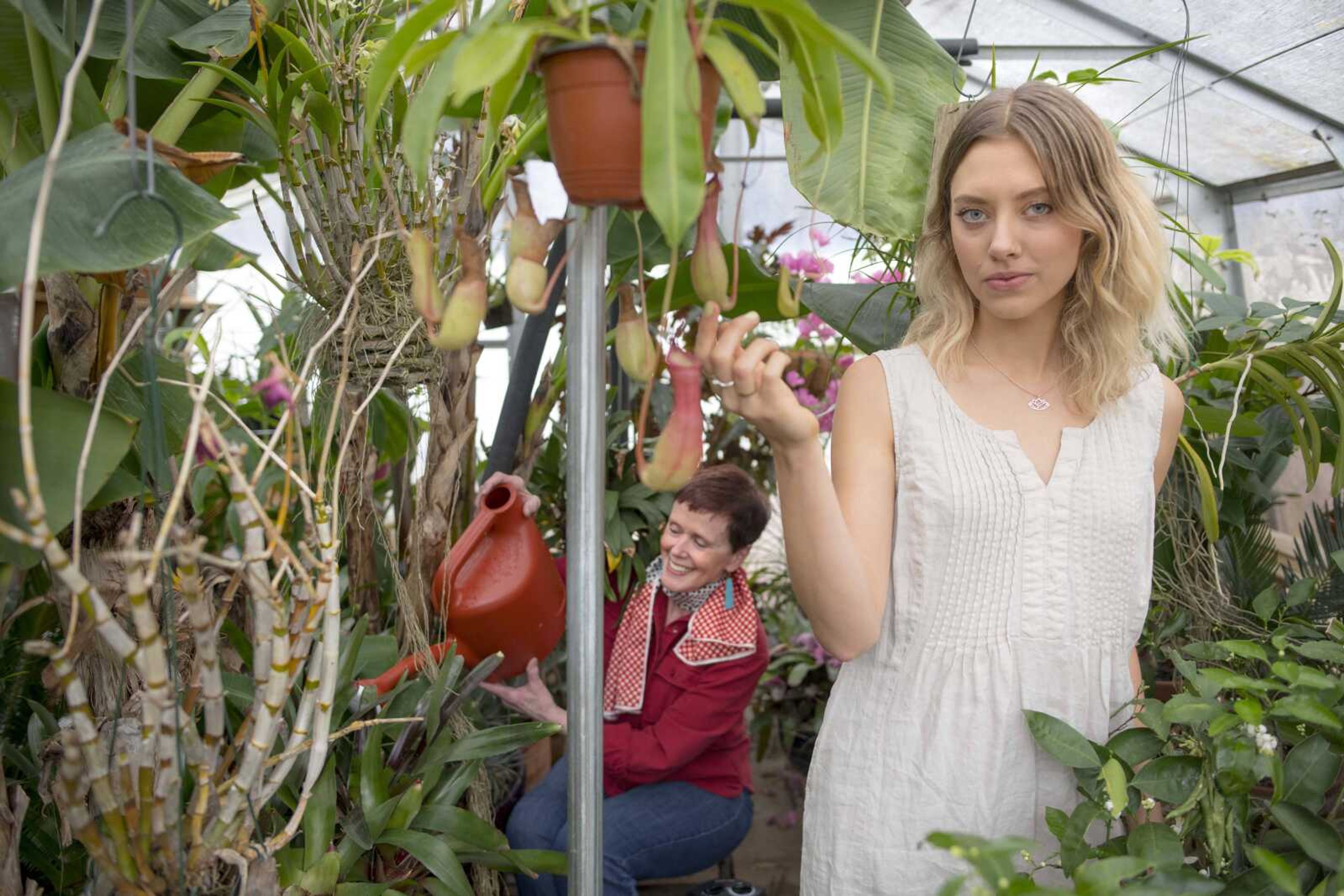 Monica Foultz, right, and Caroline Thompson pose for a photo on Friday, Jan. 24, 2020, at Jim Hoffman's home greenhouse in Cape Girardeau.