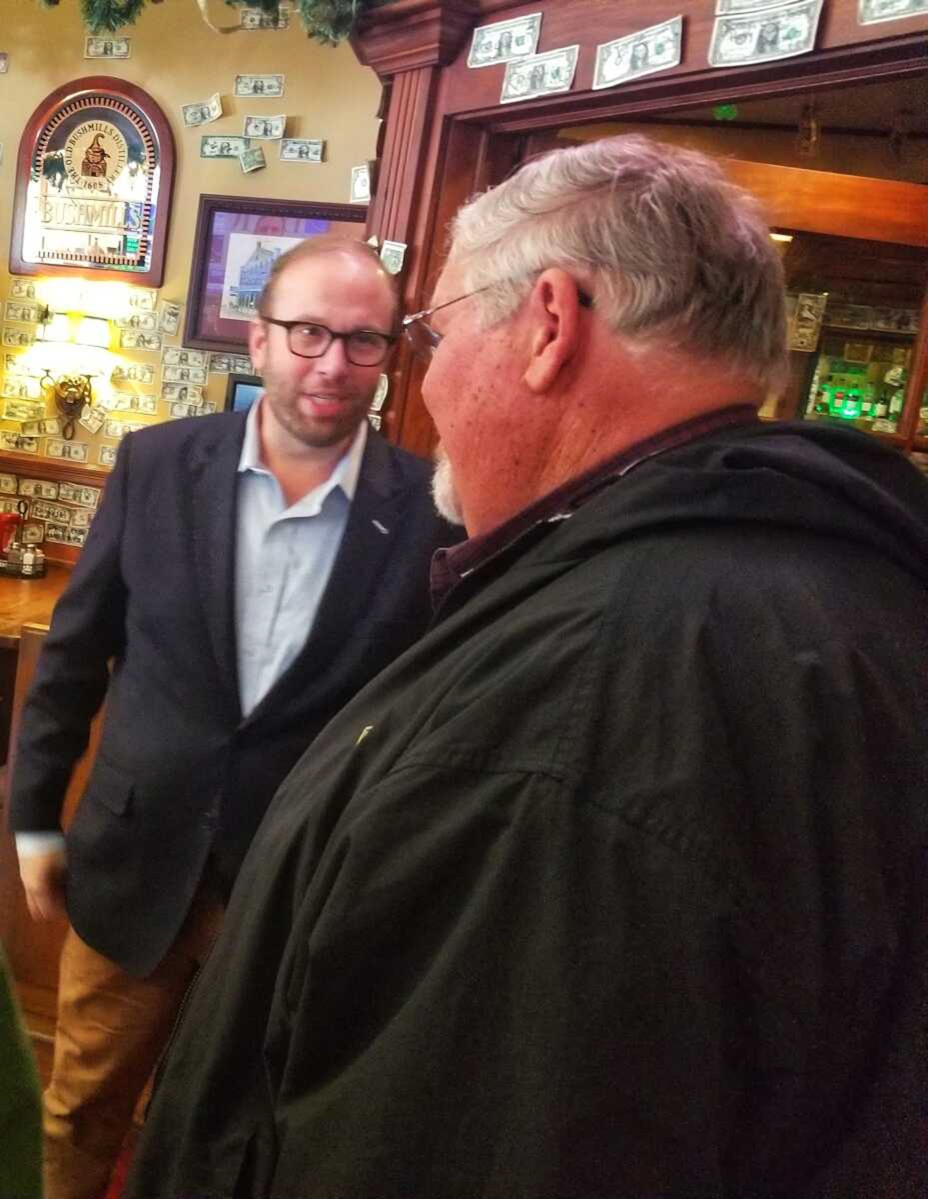 Southeast Missouri U.S. Rep. Jason Smith, left, greets Midamerica Hotels' Dan Drury on Monday, April 24, at Katy O'Ferrell's Publick House in downtown Cape Girardeau. Smith, chairman of the House Ways and Means Committee, said there are "realistic" ways for Congress to respond to environmental concerns.