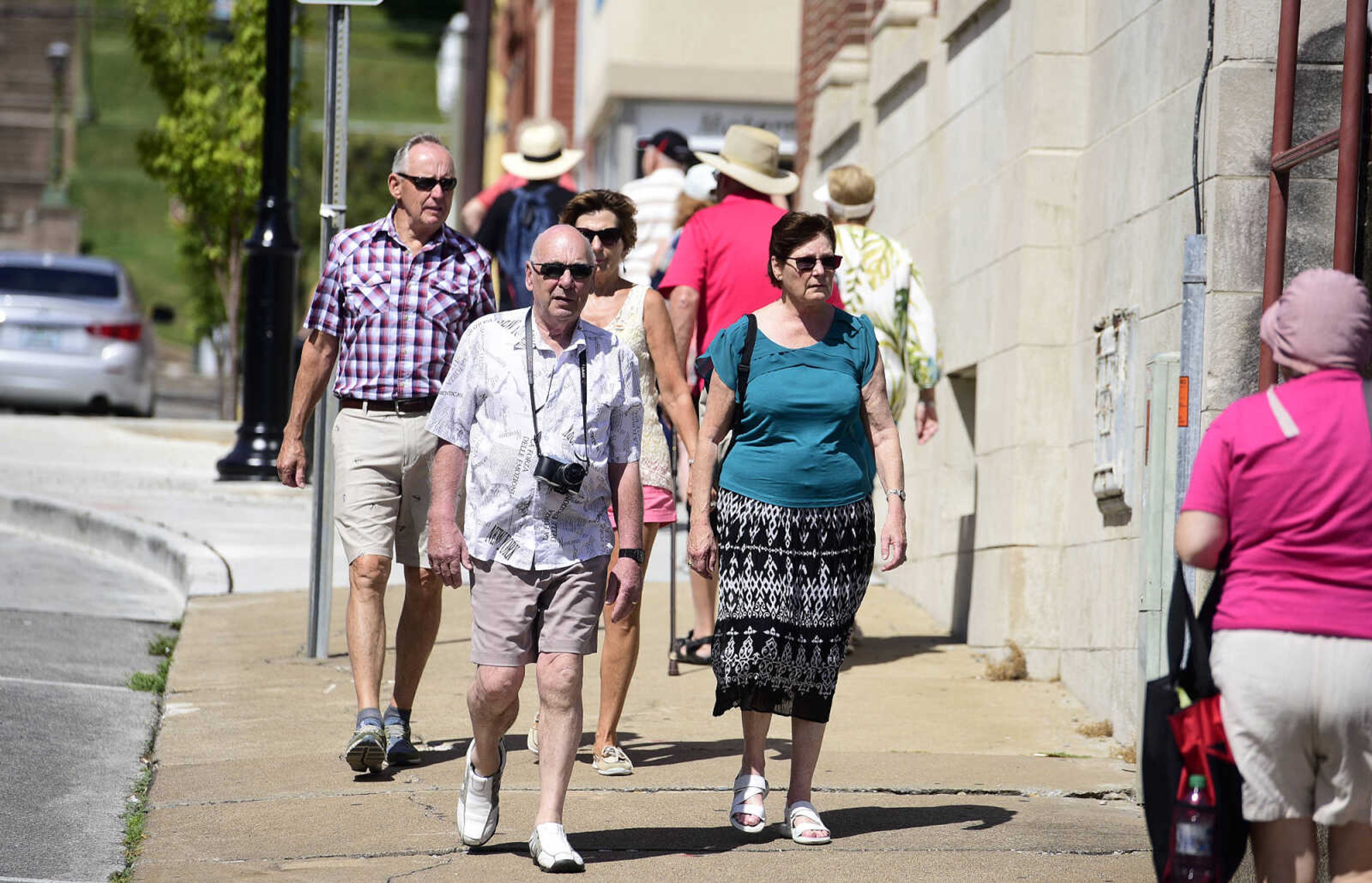 Passengers from the Queen of the Mississippi and the American Queen take in the sights on Wednesday, Aug. 23, 2017, in downtown Cape Girardeau.