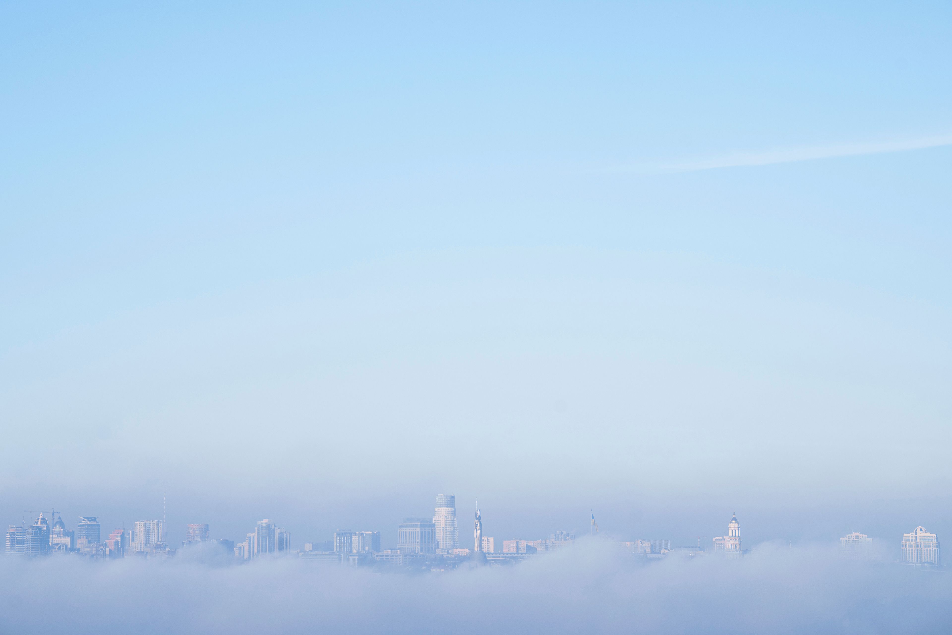 The Motherland Monument, center, and the thousand-year-old Monastery of Caves, also known as Kyiv Pechersk Lavra, the holiest site of Eastern Orthodox Christians are seen through the morning fog in Kyiv, Ukraine Monday, Nov. 25, 2024. (AP Photo/Evgeniy Maloletka)