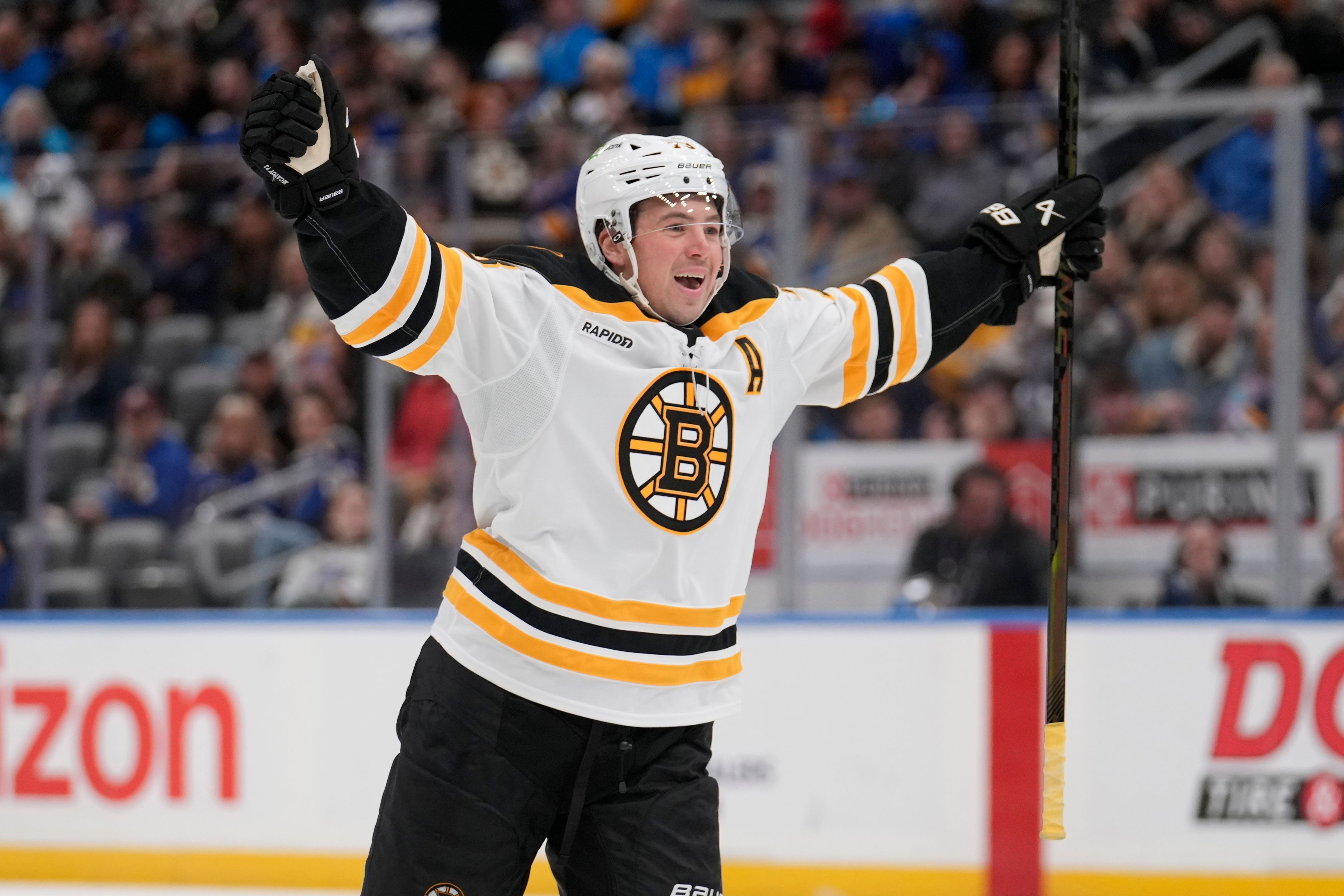 Boston Bruins' Charlie McAvoy (73) celebrates after scoring during the third period of an NHL hockey game against the St. Louis Blues Tuesday, Nov. 12, 2024, in St. Louis. (AP Photo/Jeff Roberson)