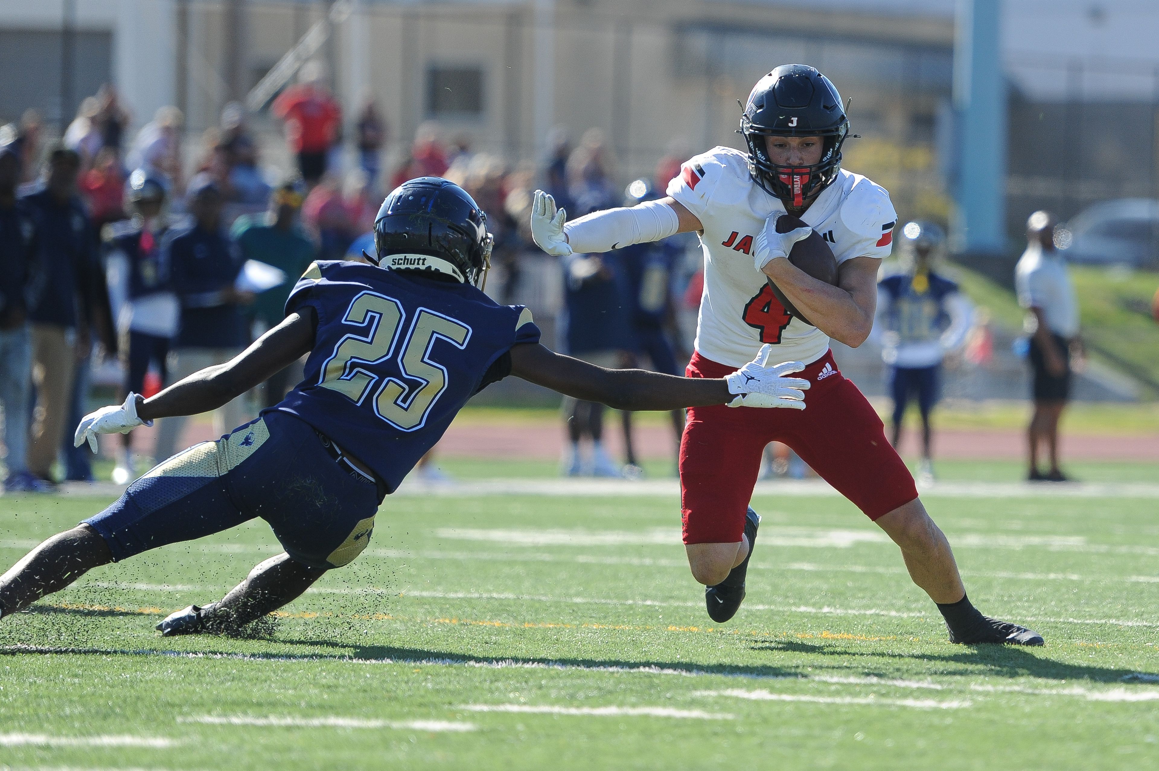 Jackson's Kai Crowe stiffs a defenders during a Saturday, October 19, 2024 game between the Miller Career/Vashon Phoenix and the Jackson Indians at Gateway STEM High School in St. Louis. Jackson defeated Miller Career, 55-14.