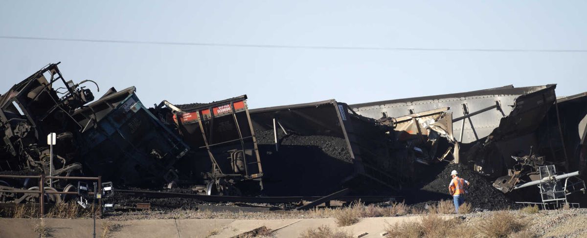 Semitruck driver killed when train derails on Colorado bridg...