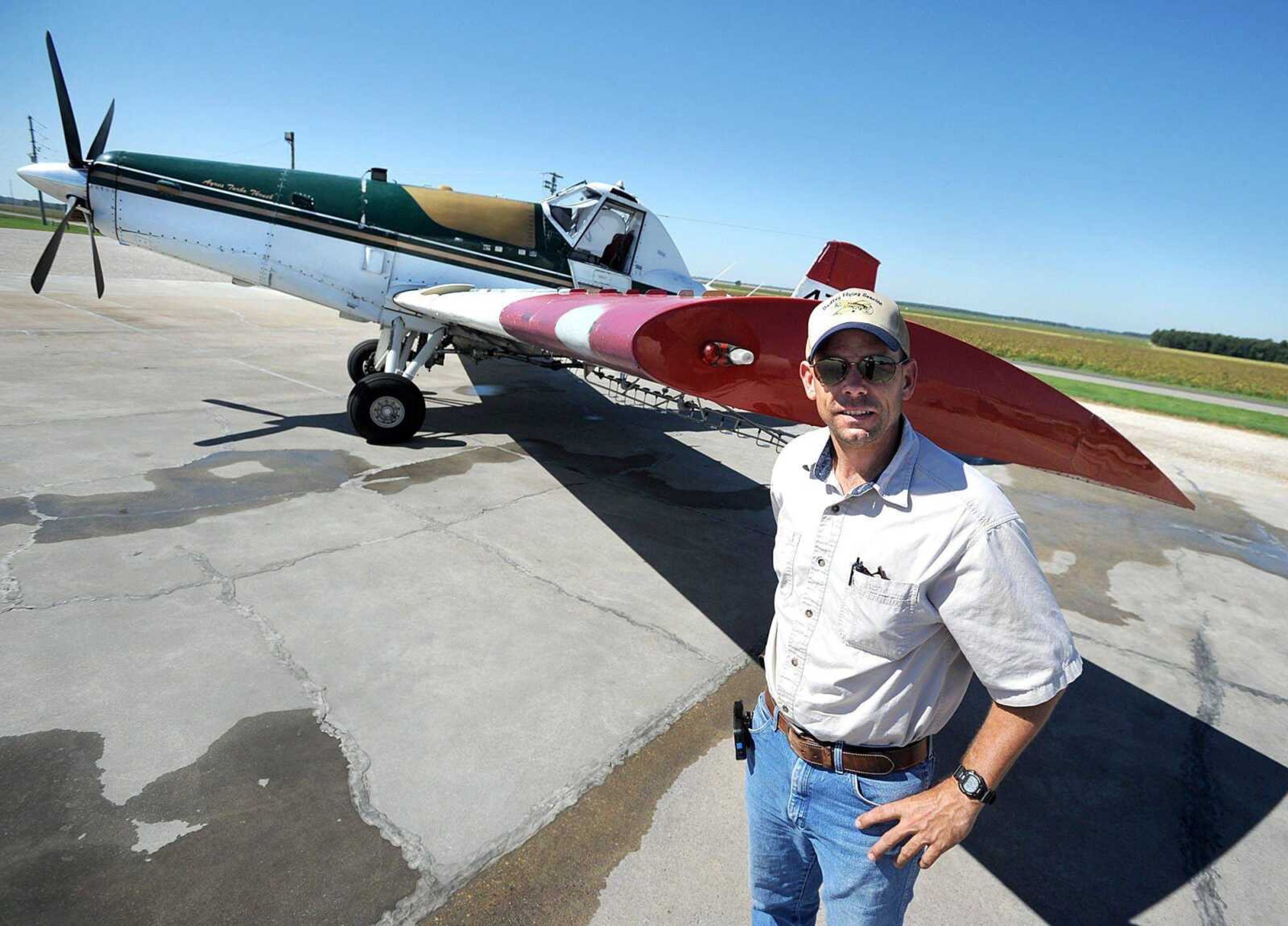 Matt Peed stands in front of a 510 Thrush aircraft at Dudley Flying Service. (Laura Simon)