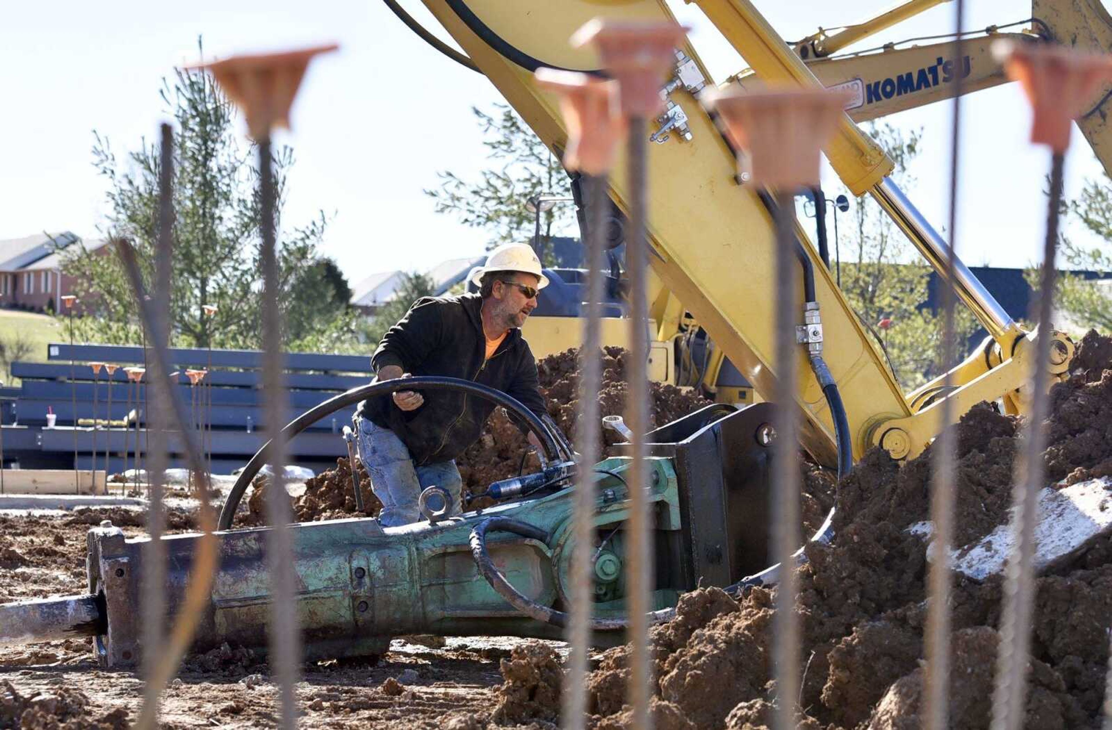 Billy Tennehill detaches a rock breaker from an excavator at the future site of the Cape Girardeau Fire Station No. 4 on Thursday.