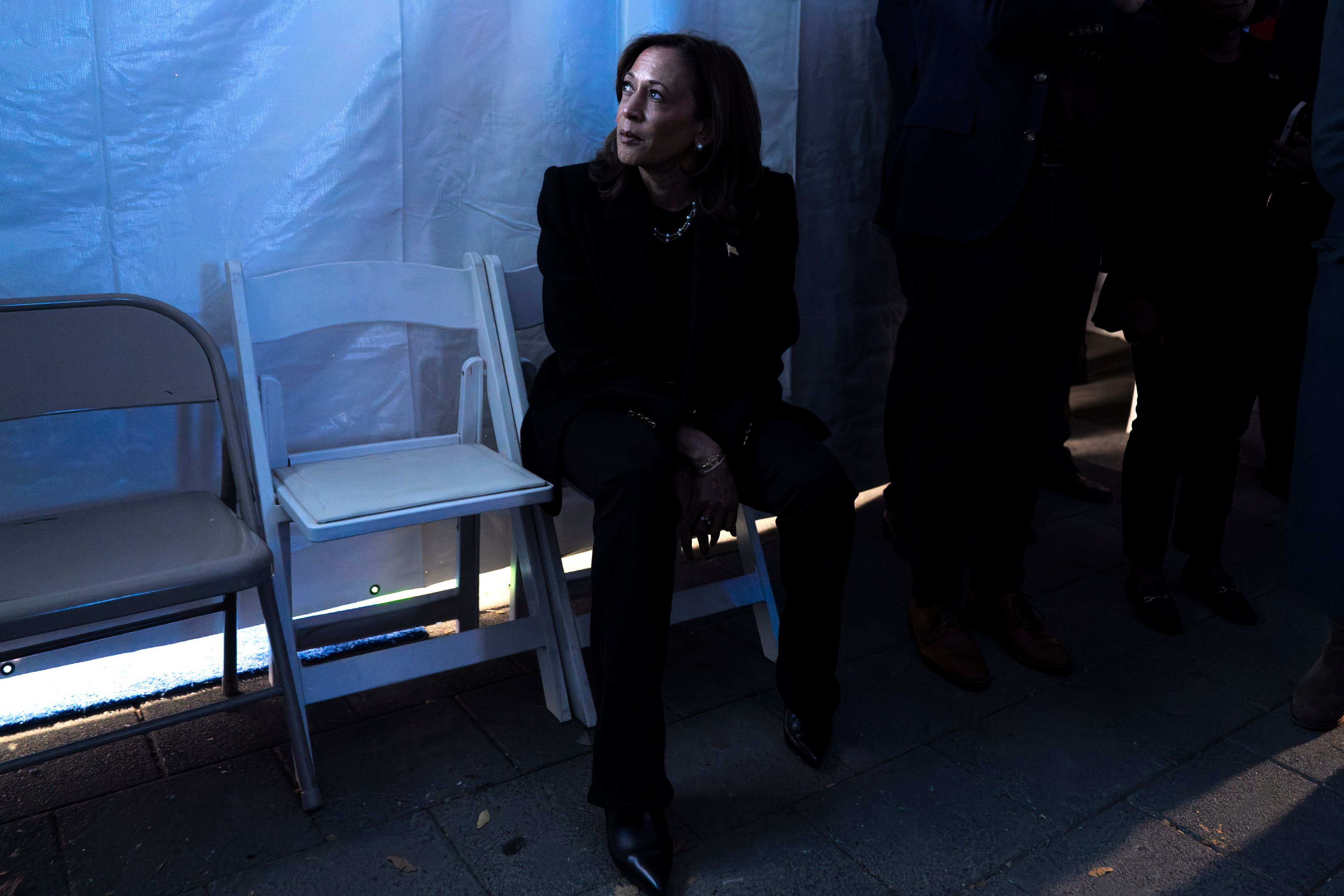 Democratic presidential nominee Vice President Kamala Harris looks at a monitor backstage, just before taking the stage for her final campaign rally, Monday, Nov. 4, 2024, in Philadelphia. (AP Photo/Jacquelyn Martin)