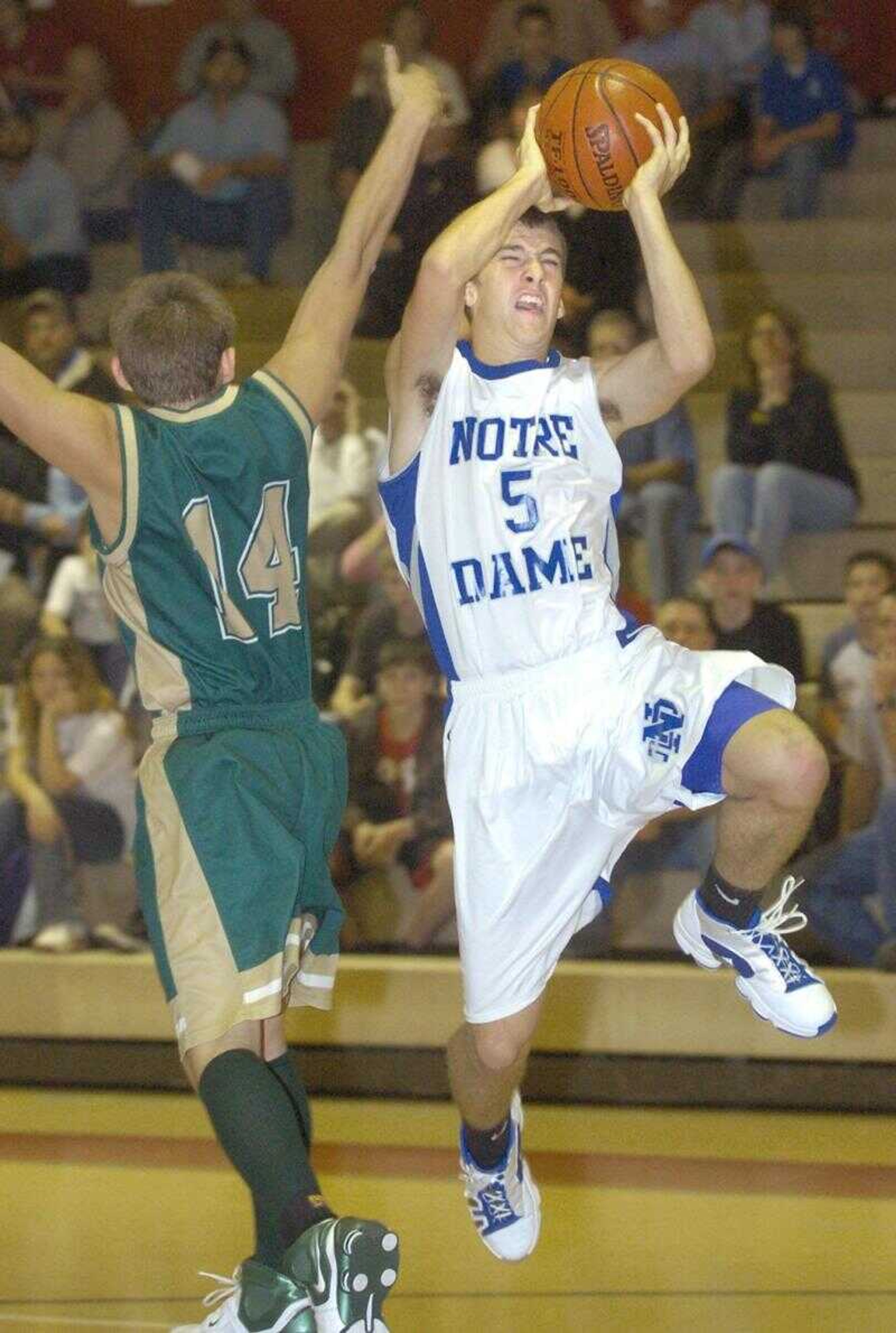 Notre Dame's Abe Dirnberger drove for a layup past Zalma's Tim Rodgers in the first quarter of the opening game of the Woodland Invitational at Marble Hill Monday night. (Fred Lynch)