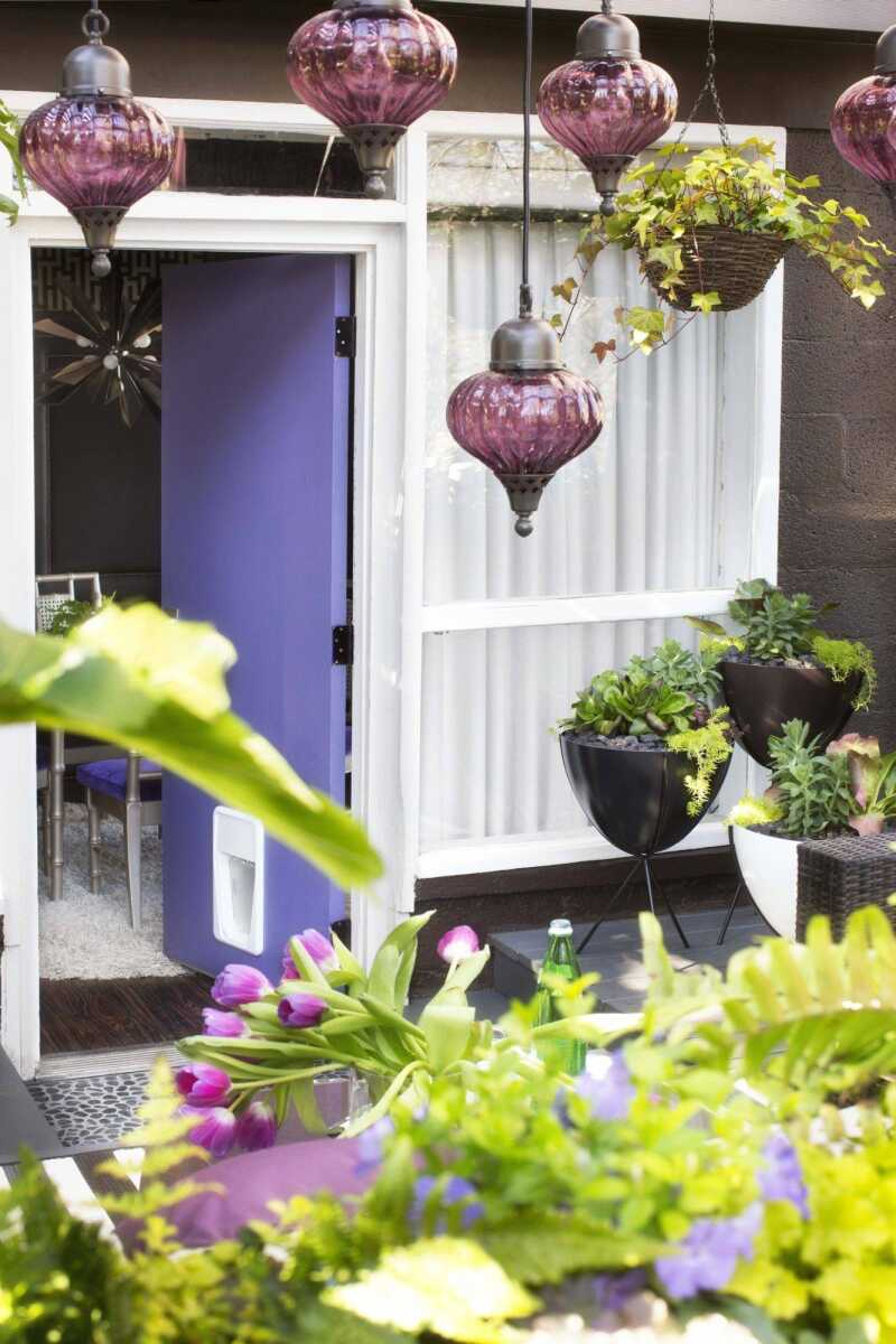 If you love bold colors but worry they'd be overpowering on your front door, consider putting a striking shade on a side door.