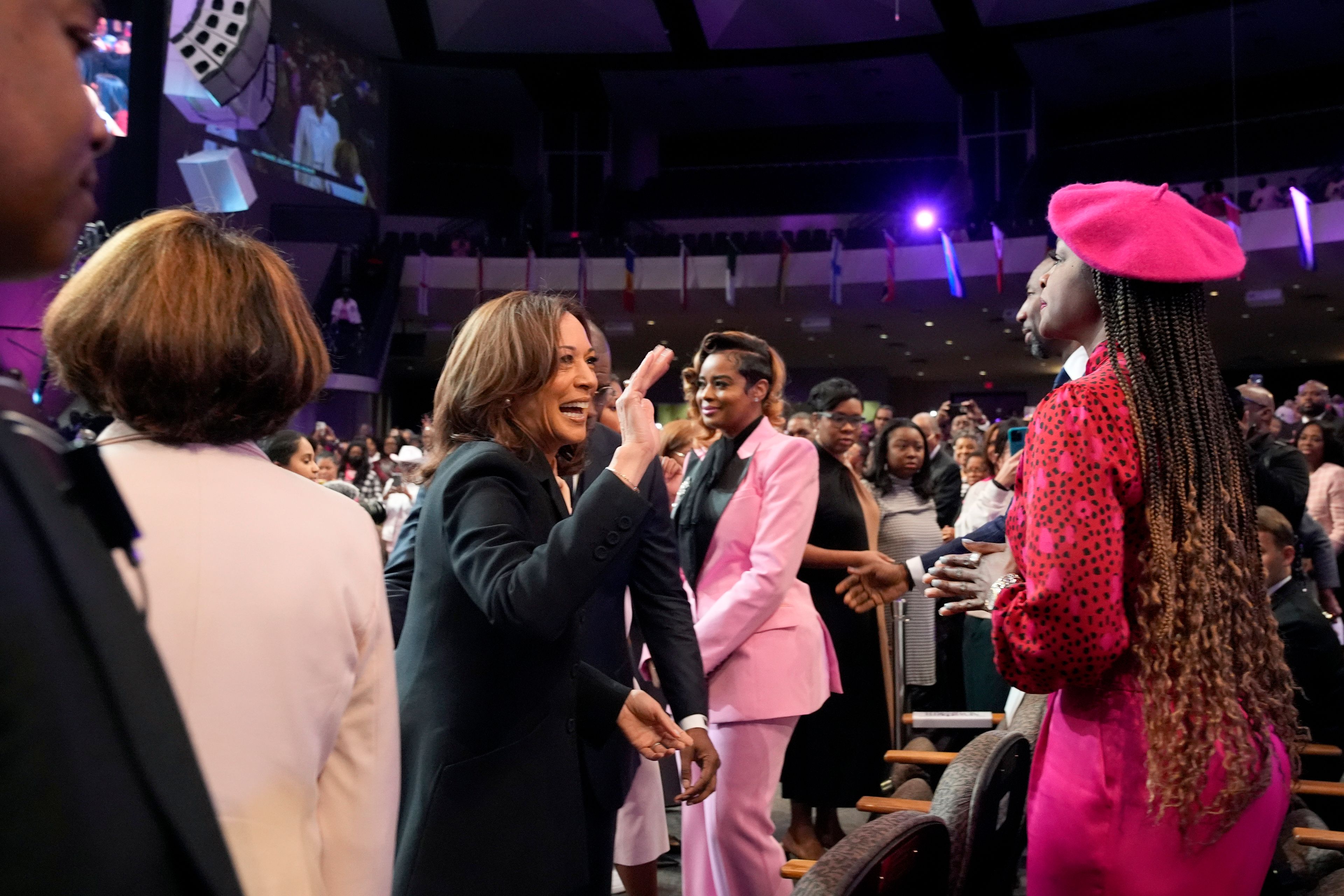 Democratic presidential nominee Vice President Kamala Harris waves to the congregation as she arrives to speak at a church service at New Birth Baptist Church in Stonecrest, Ga., Sunday, Oct. 20, 2024. (AP Photo/Jacquelyn Martin)