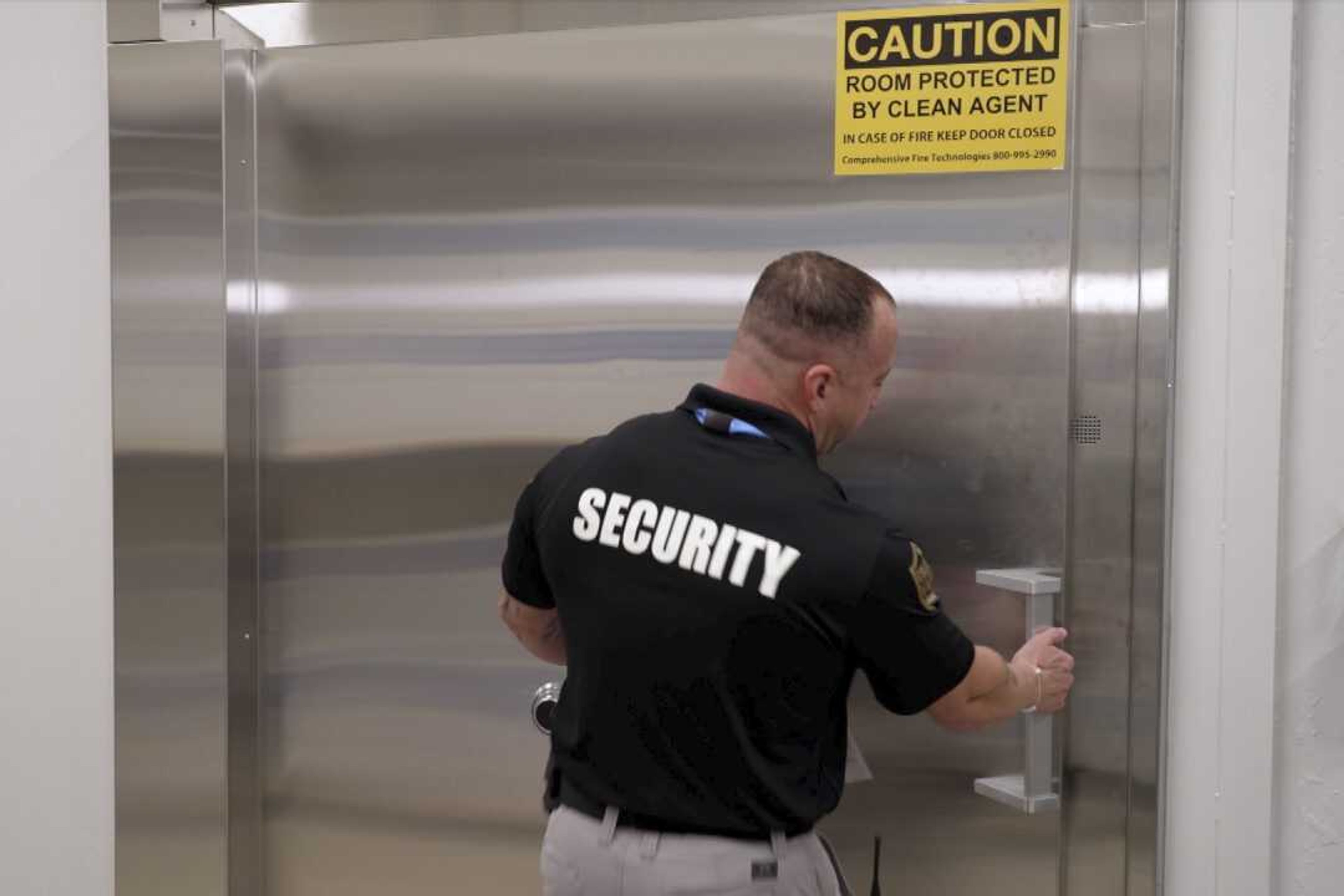 A security guard opens a steel door leading into a vault containing hundreds of collectibles at Collectors Vault, a new company that is making it easier for collectors to store and trade memorabilia, on Oct. 21 in Delaware. The door is nearly 2 feet thick and is meant to protect the valuables from harm and thieves.