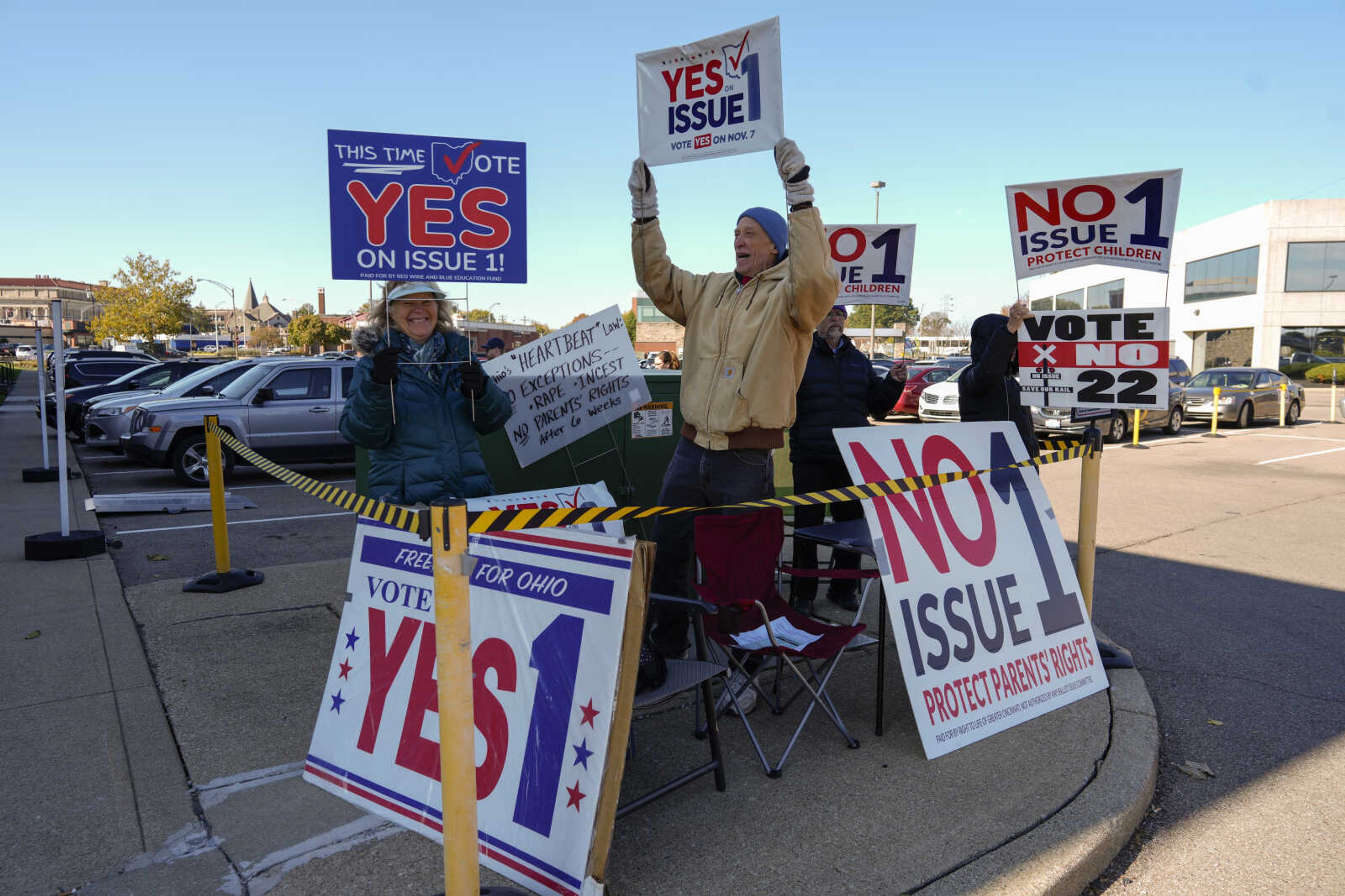 FILE - People gather in the parking lot of the Hamilton County Board of Elections as people arrive for early in-person voting in Cincinnati, Nov. 2, 2023. Ohio's new constitutional projections for abortion access are supposed to take effect Dec. 7. But existing abortion-related lawsuits are moving again now that voters have decided the question, creating uncertainty about how and when the amendment will be implemented. (AP Photo/Carolyn Kaster, File)