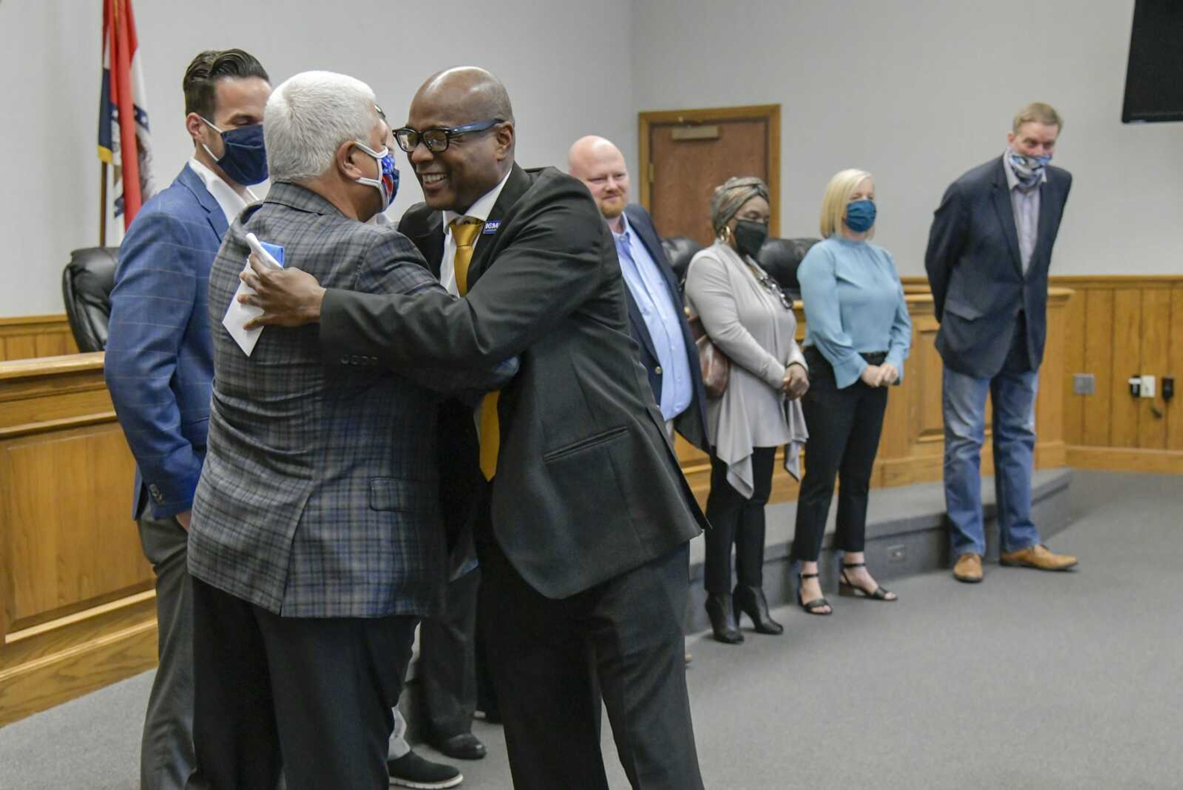 Incoming city manager, Kenneth Haskin, hugs mayor Bob Fox after making a speech at Thursday's news conference in the chambers of the Cape Girardeau City Council in Cape Girardeau.