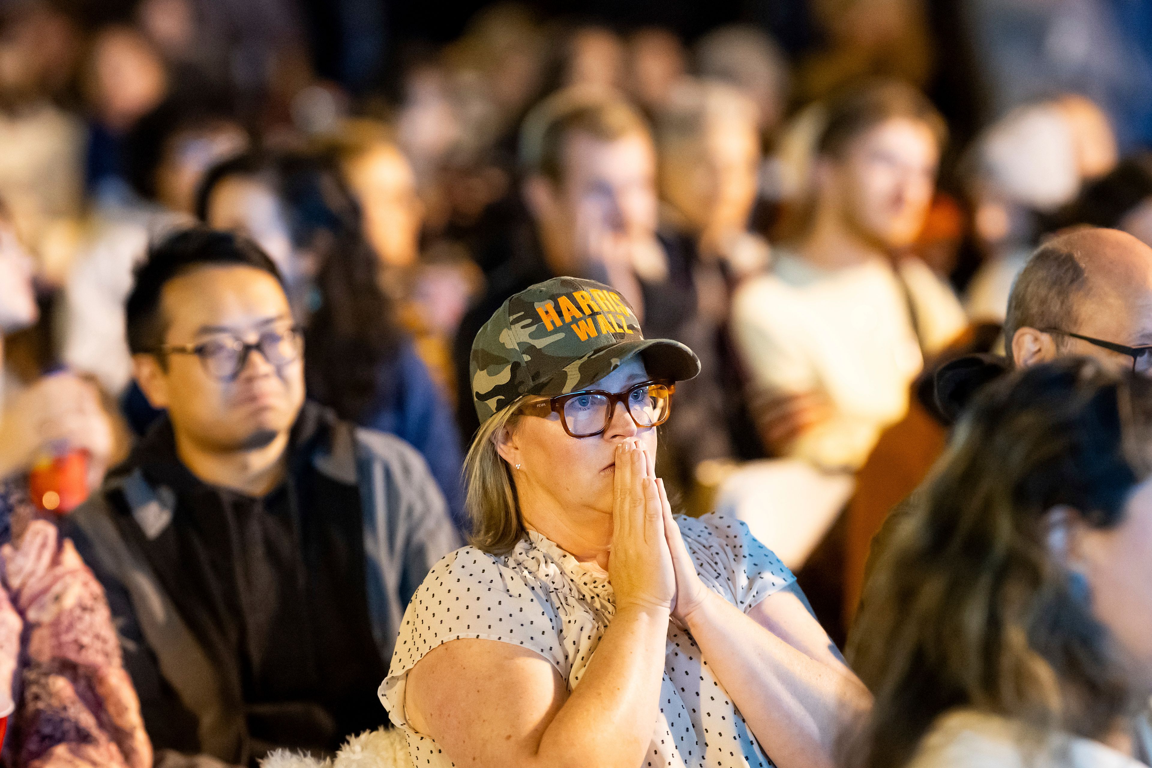 Jessica Reid reacts while watching election results update on a jumbo screen television in San Francisco on Tuesday, Nov. 5, 2024. (AP Photo/Noah Berger)