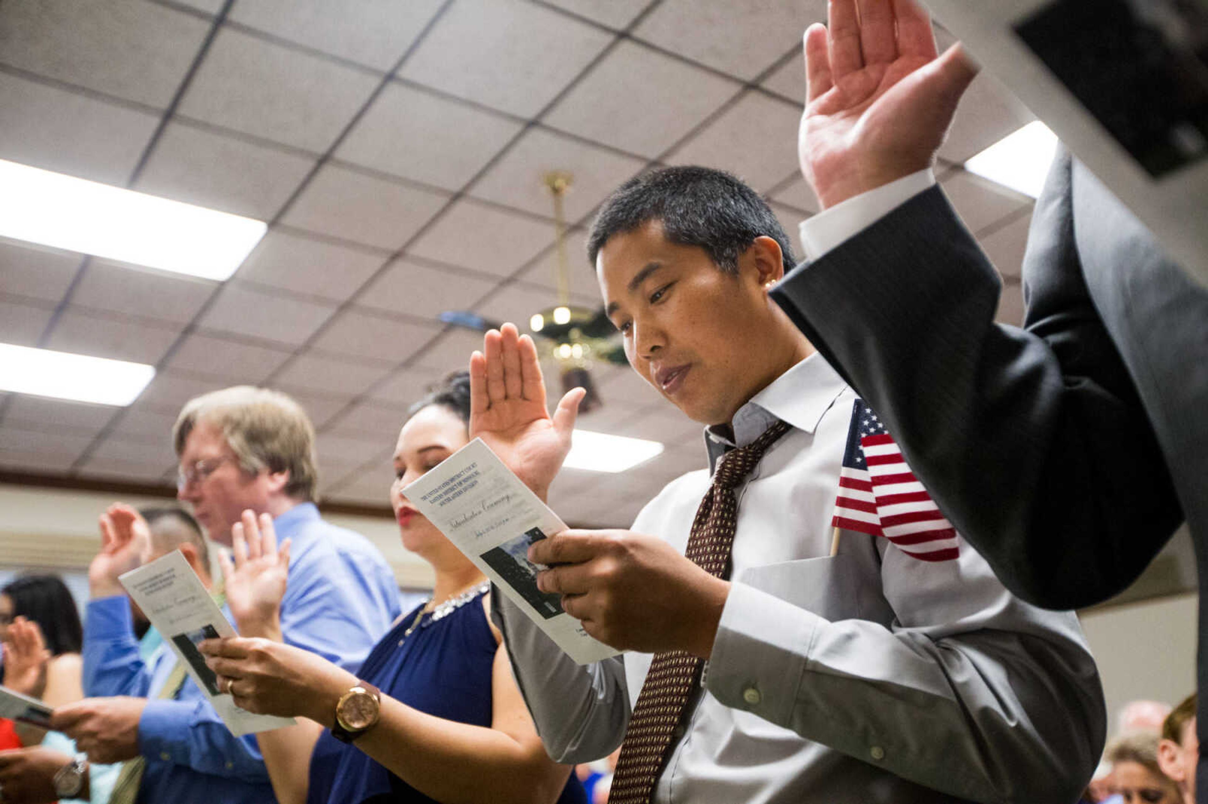 GLENN LANDBERG ~ glandberg@semissourian.com


Petitioners recite the Oath of Allegiance while being sworn in as a U.S. citizens during a naturalization ceremony Monday, July 4, 2016 at the Common Pleas Courthouse in Cape Girardeau.