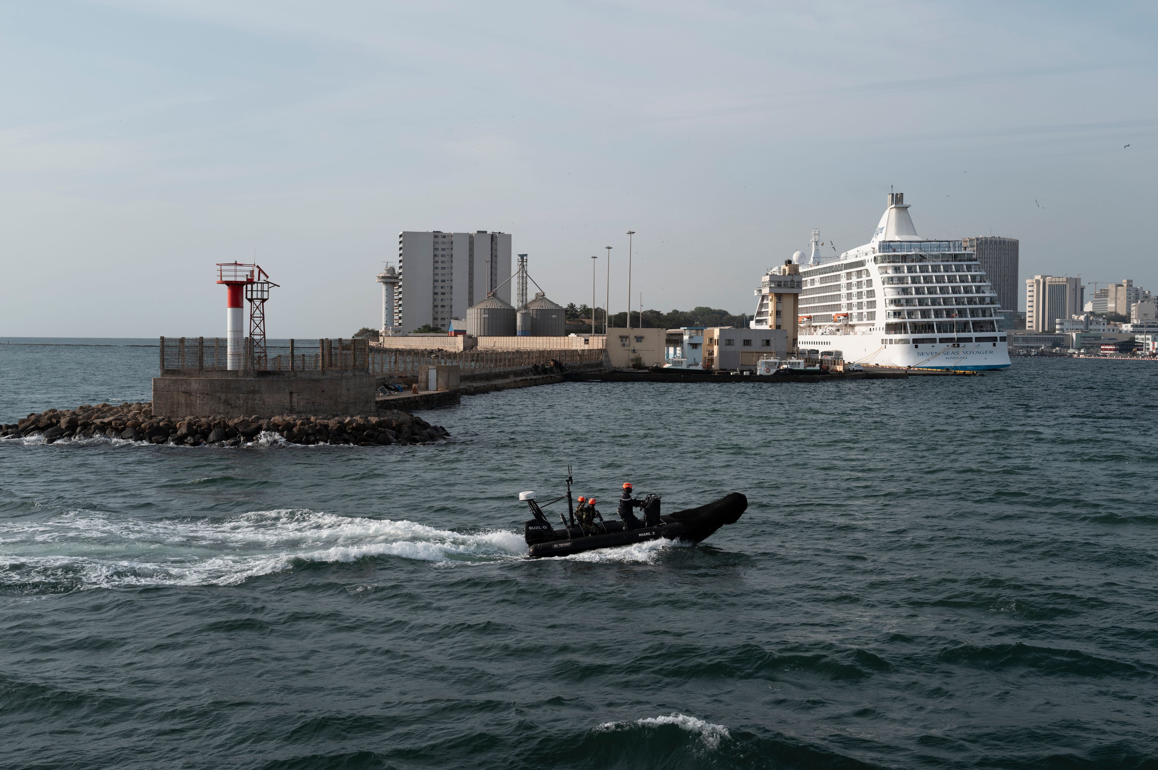 Senegalese sailors in their zodiac return to port following a mission to search for illegal migrant boats near the coast of Dakar, Senegal, Saturday, Nov.16, 2024. (AP Photo/Sylvain Cherkaoui)