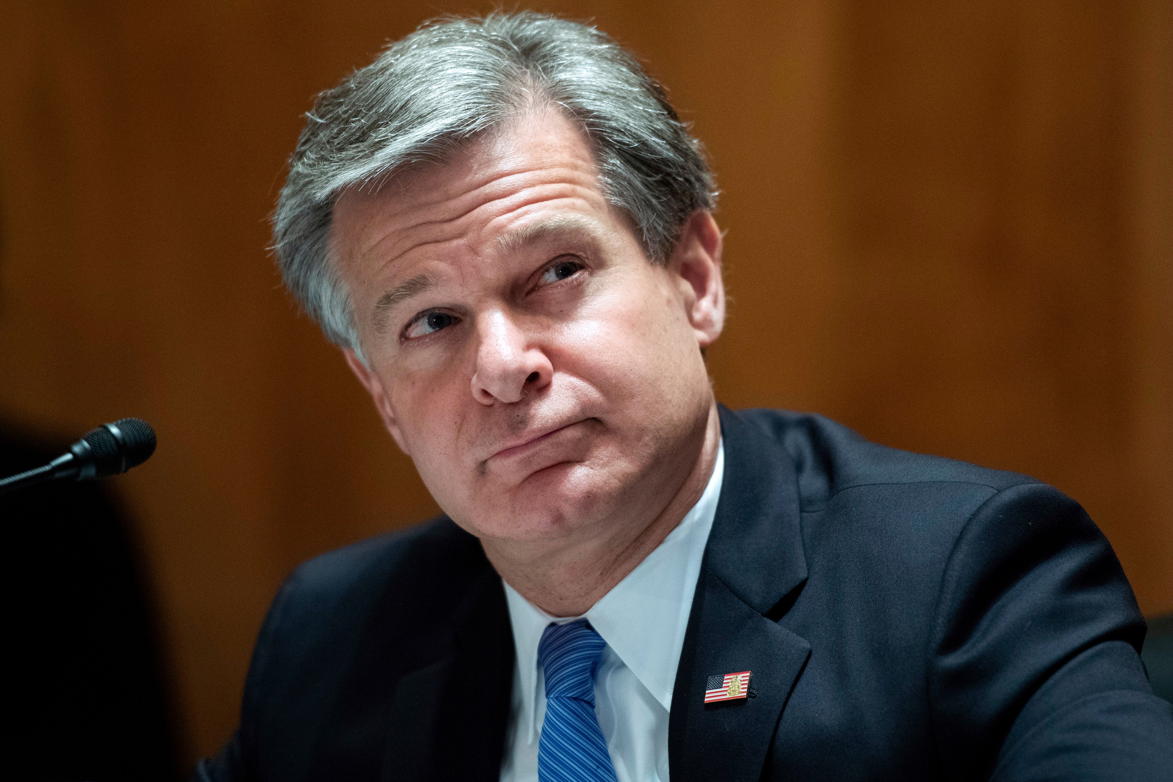 FILE - FBI Director Christopher Wray testifies on Capitol Hill in Washington, Sept. 24, 2020. (Tom Williams/Pool via AP, File)