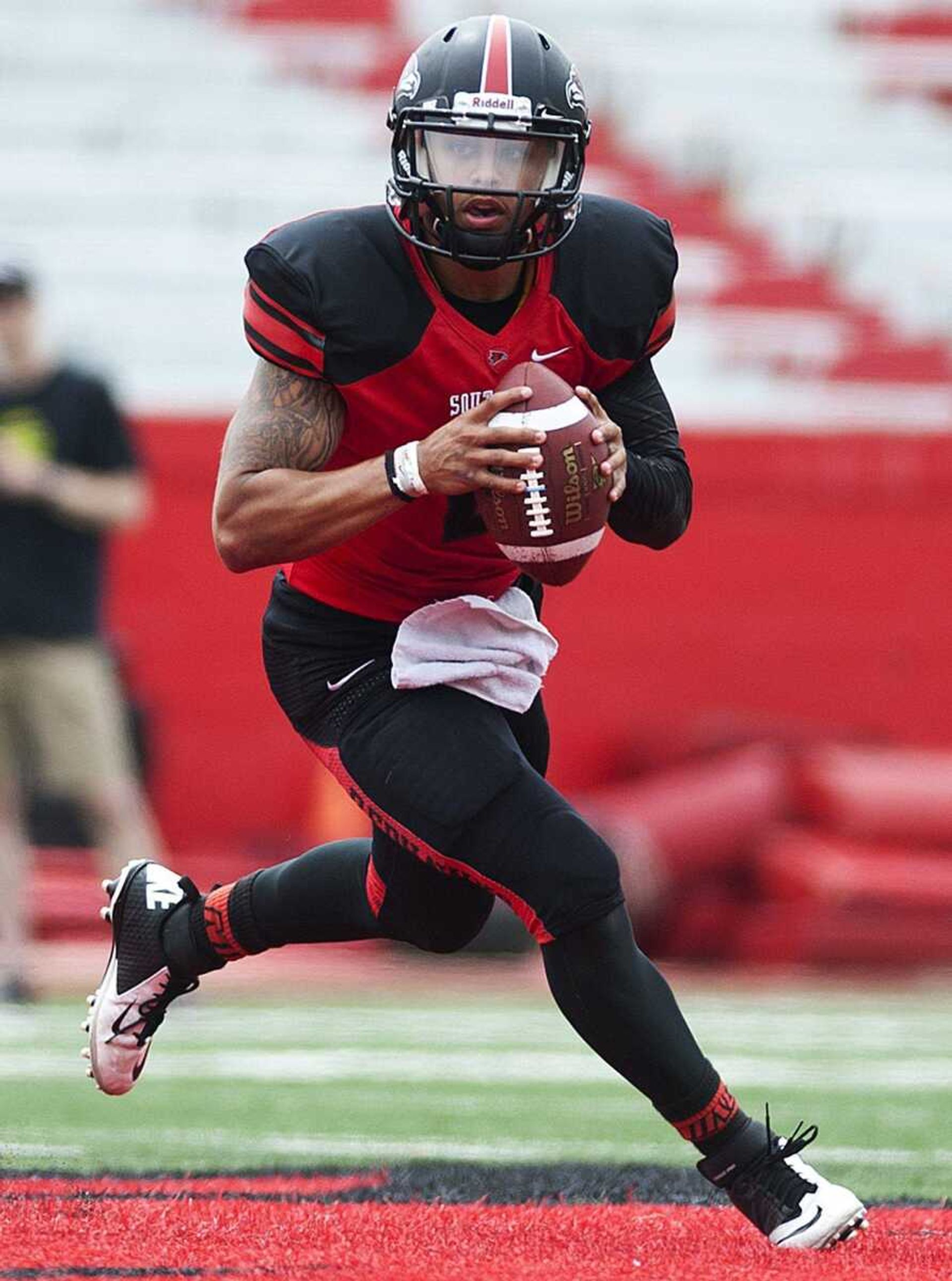 Red Team quarterback Blake Jackson drops back to pass in the fourth quarter of Red's 28-0 loss to the WhiteTeam in the Southeast Missouri State University's 2014 Spring Game Saturday, April 26, at Houck Stadium. (Adam Vogler)