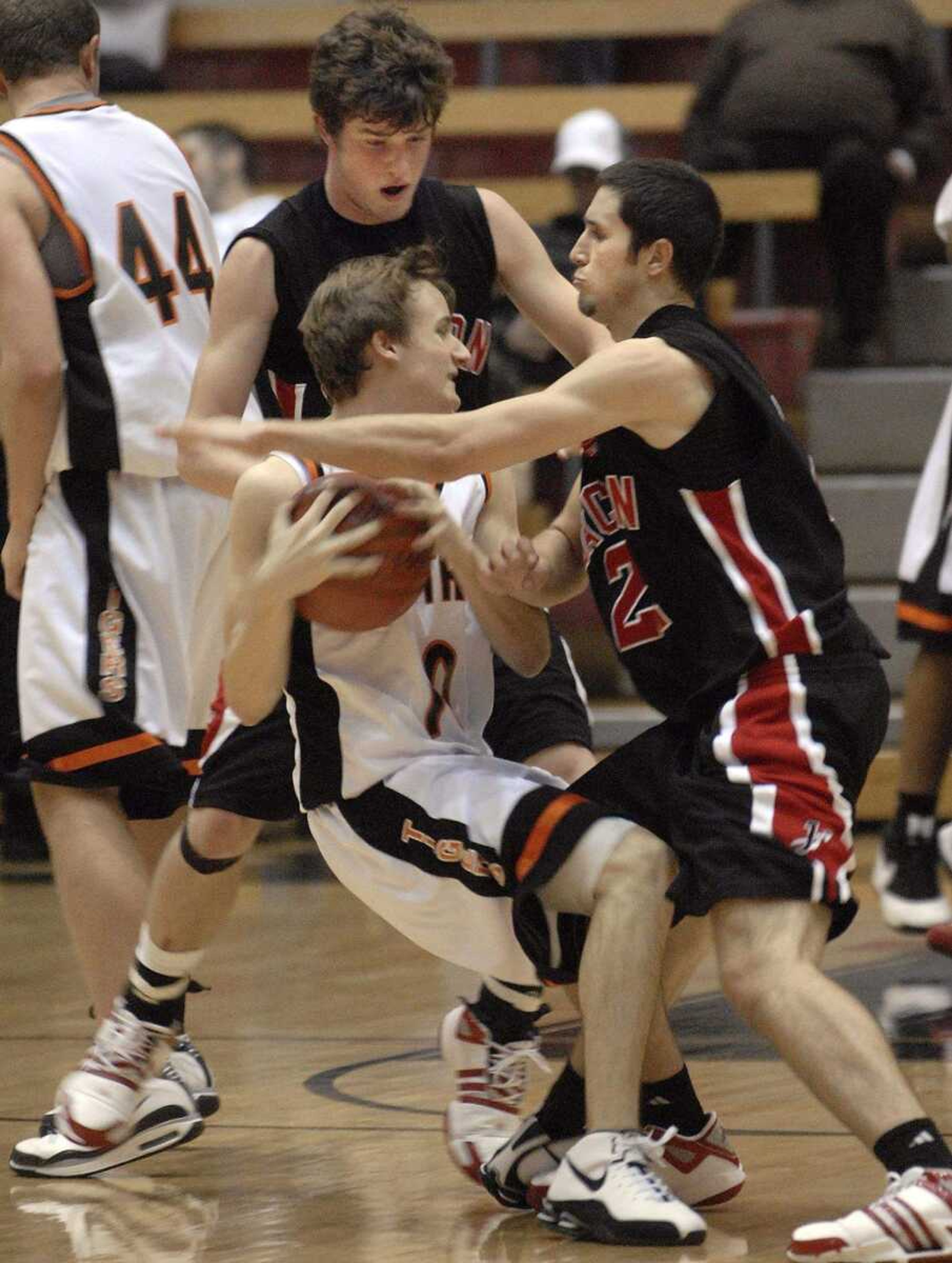 FRED LYNCH ~ flynch@semissourian.com
Central's Dylan Thomas is trapped between Jackson's Marcus Harris and Andrew Shrum in the third quarter Friday at the SEMO Conference tournament in Sikeston.