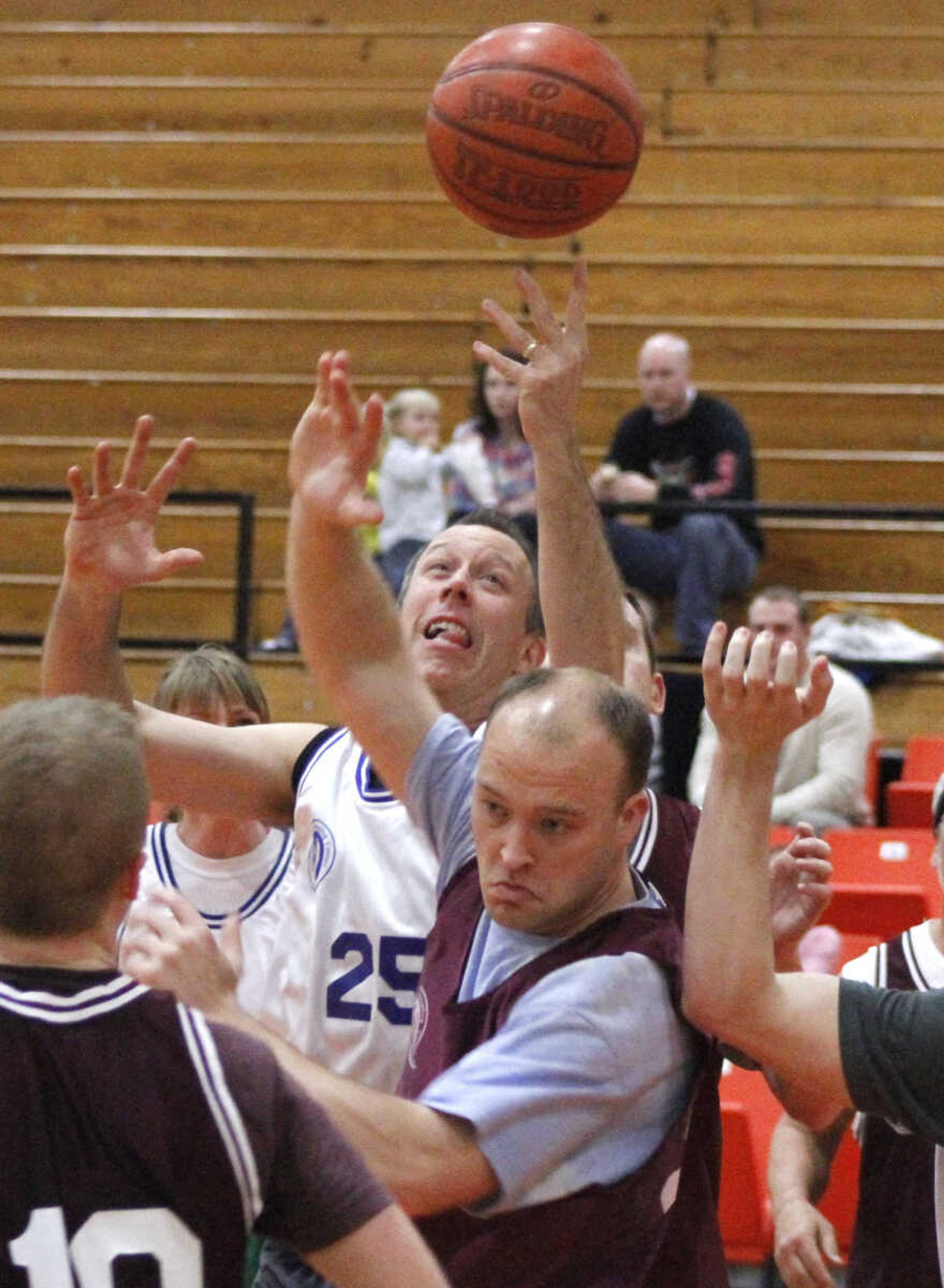 JONATHAN BRIDGES ~ photos@semissourian.com
The Doctor's Mark Meadors reaches for the rebound from the Lawyers Saturday, March 3, 3012 during the 19th annual Doctors vs. Lawyers basketball showdown at Cape Central Junior High School in Cape Girardeau. Doctors won 84-70.