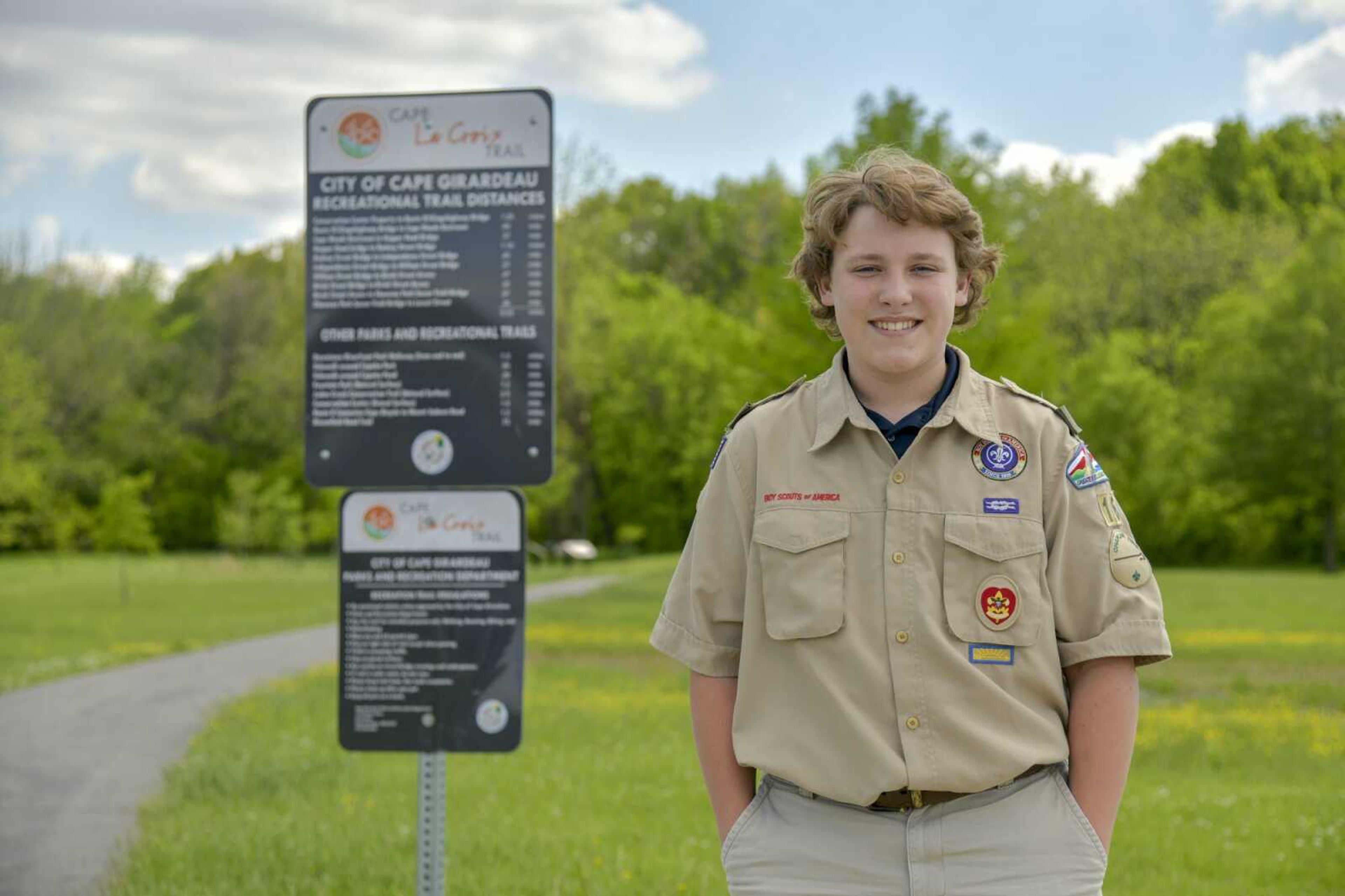 Boy Scout Jacob Mahnke, 14, of Cape Girardeau poses Wednesday near an entrance of the Cape LaCroix Trail by the Osage Centre, one of the locations he plans to install a bike repair station  and air pump as his Eagle Scout project.