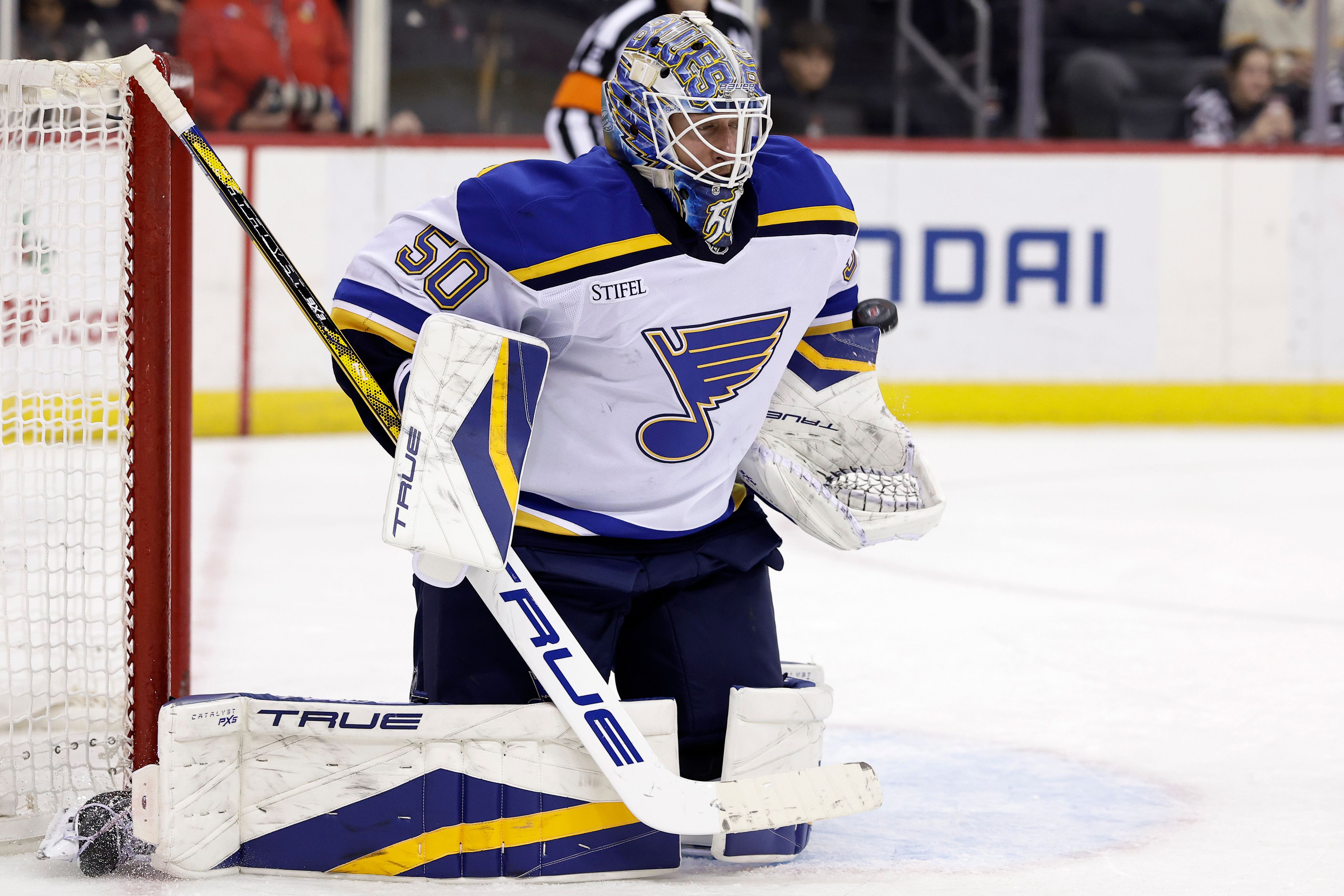 St. Louis Blues goaltender Jordan Binnington makes a save during the second period of an NHL hockey game against the New Jersey Devils Wednesday, Nov. 27, 2024, in Newark, N.J. (AP Photo/Adam Hunger)