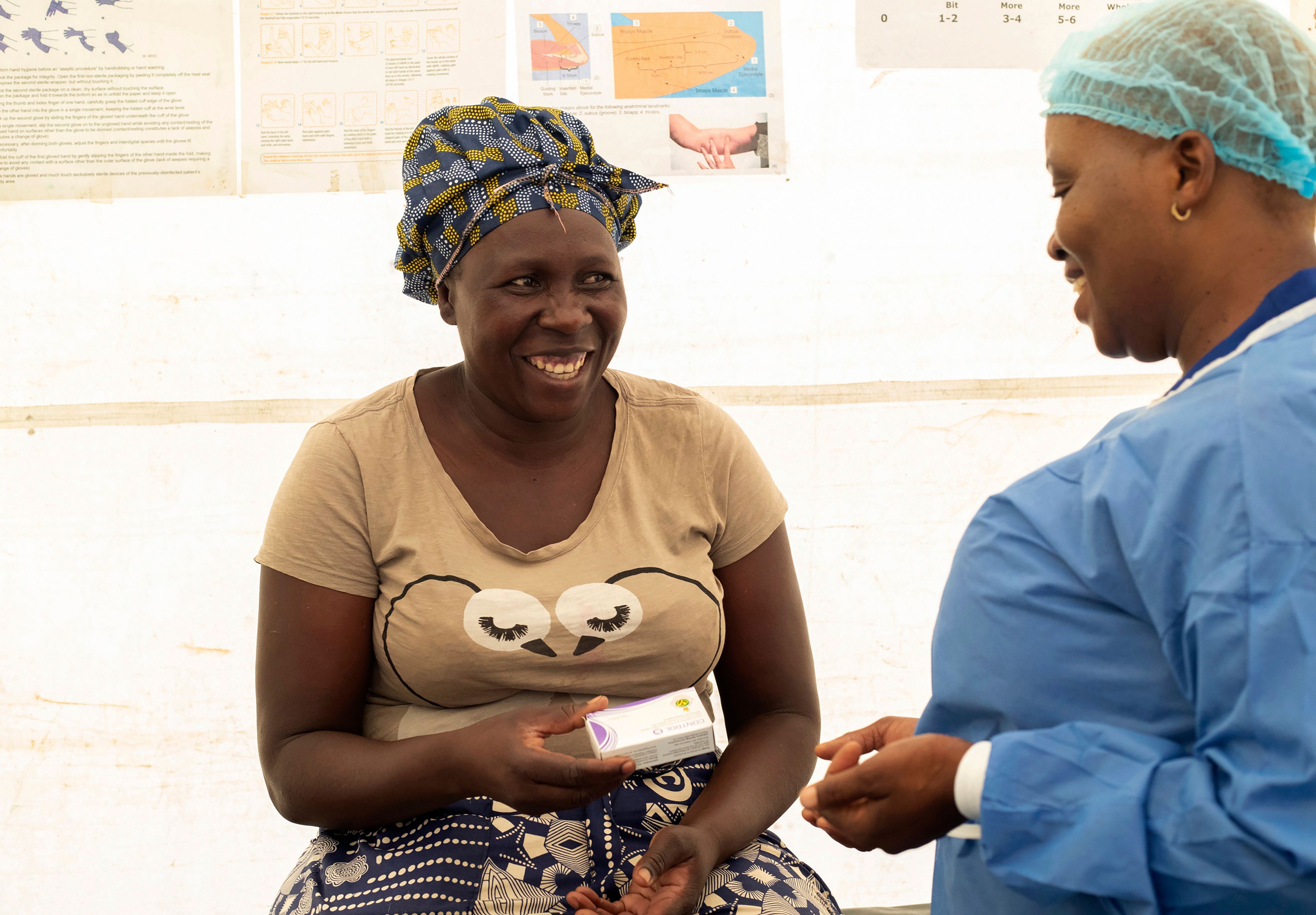 41 year old Catherine Tavaruva receives contraceptive pills at an outreach clinic in Epworth, Zimbabwe, Thursday, Nov. 14, 2024. (AP Photo/Aaron Ufumeli)