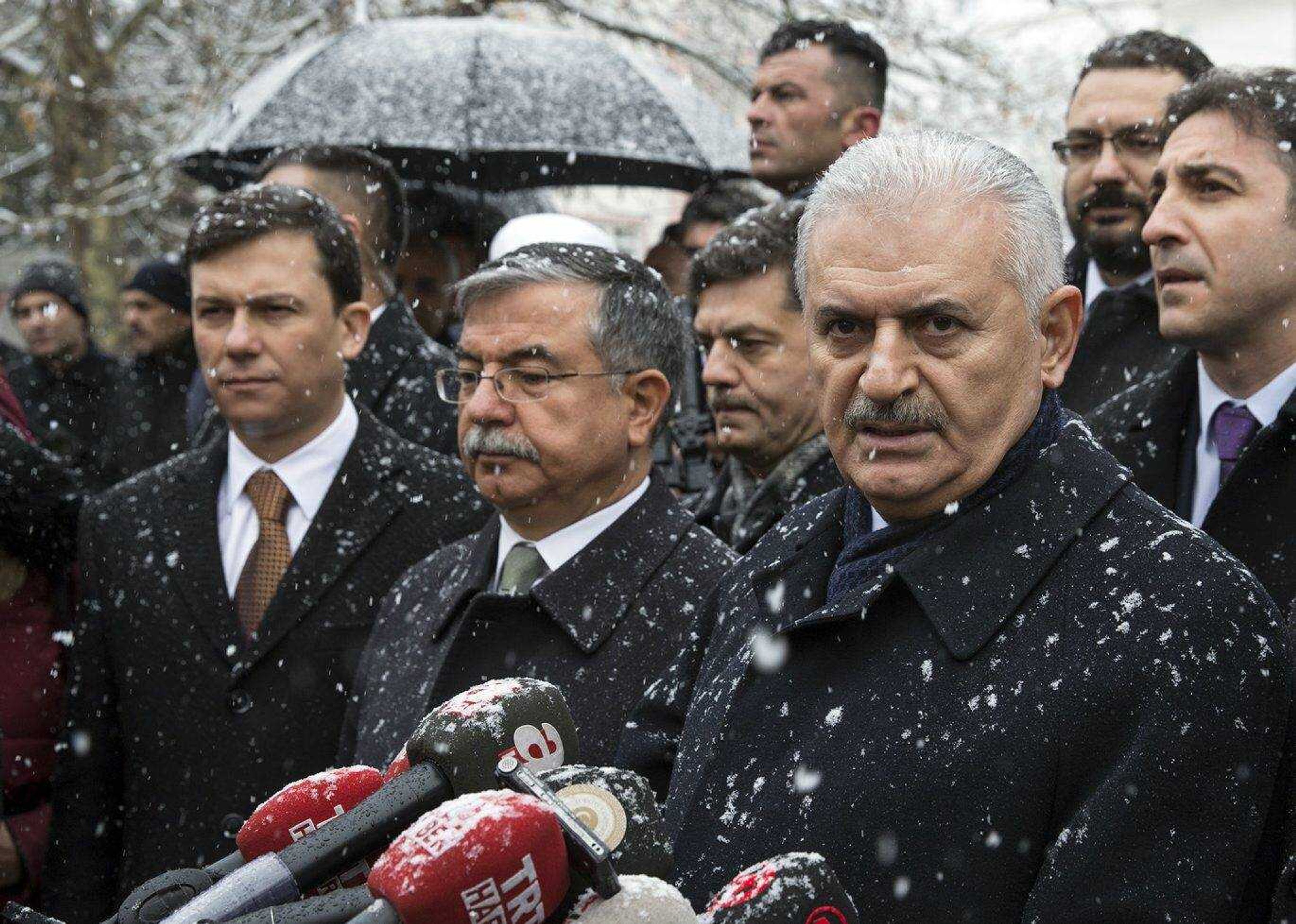 Turkey Prime Minister Binali Yildirim speaks Friday to reporters in Ankara, Turkey. Yildirim said he hoped the cease-fire in Syria holds and turns into a lasting peace.