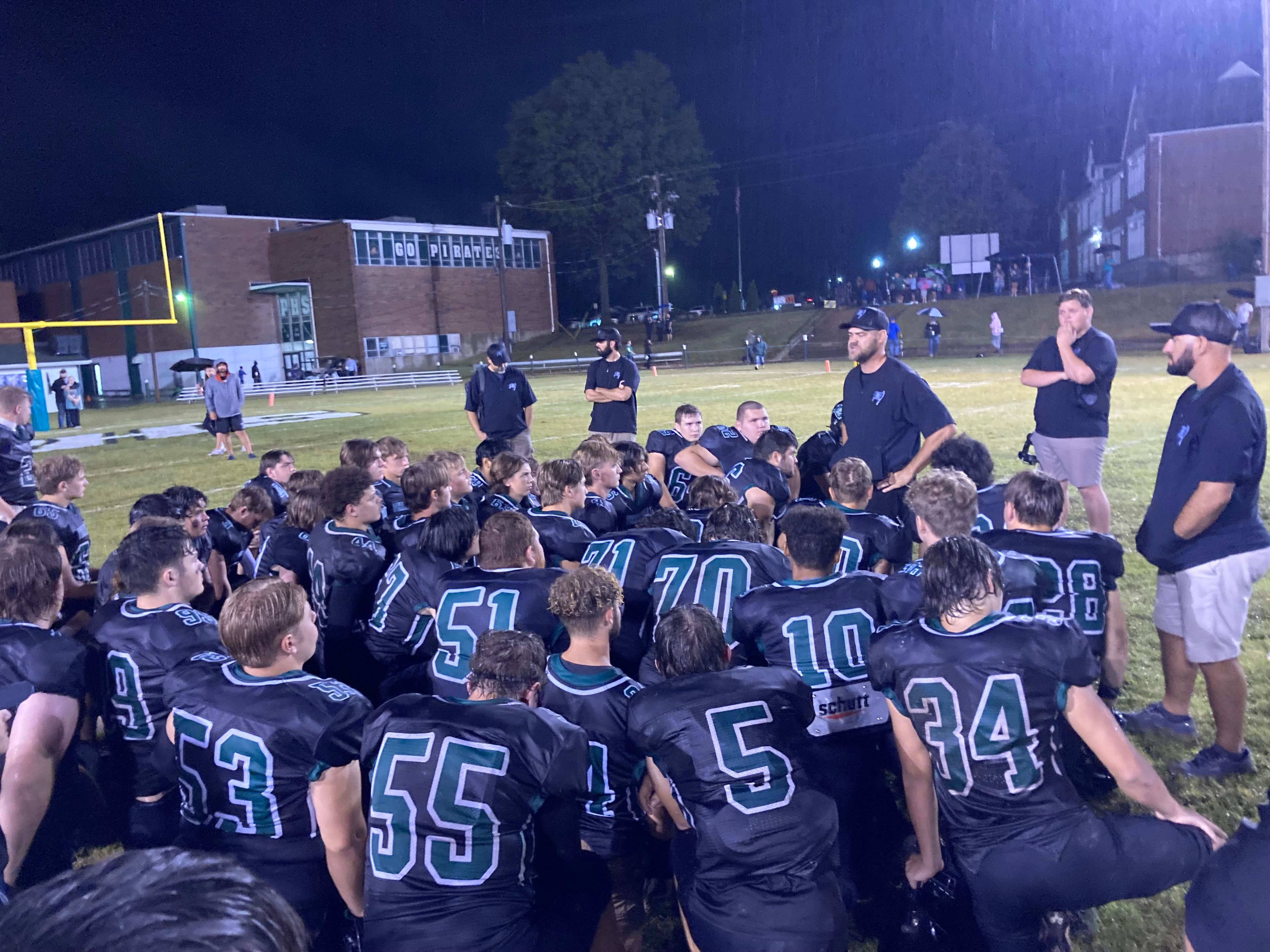 Perryville head coach Brent Roth, third from right, talks to his squad after Friday's home loss to St. Vincent.