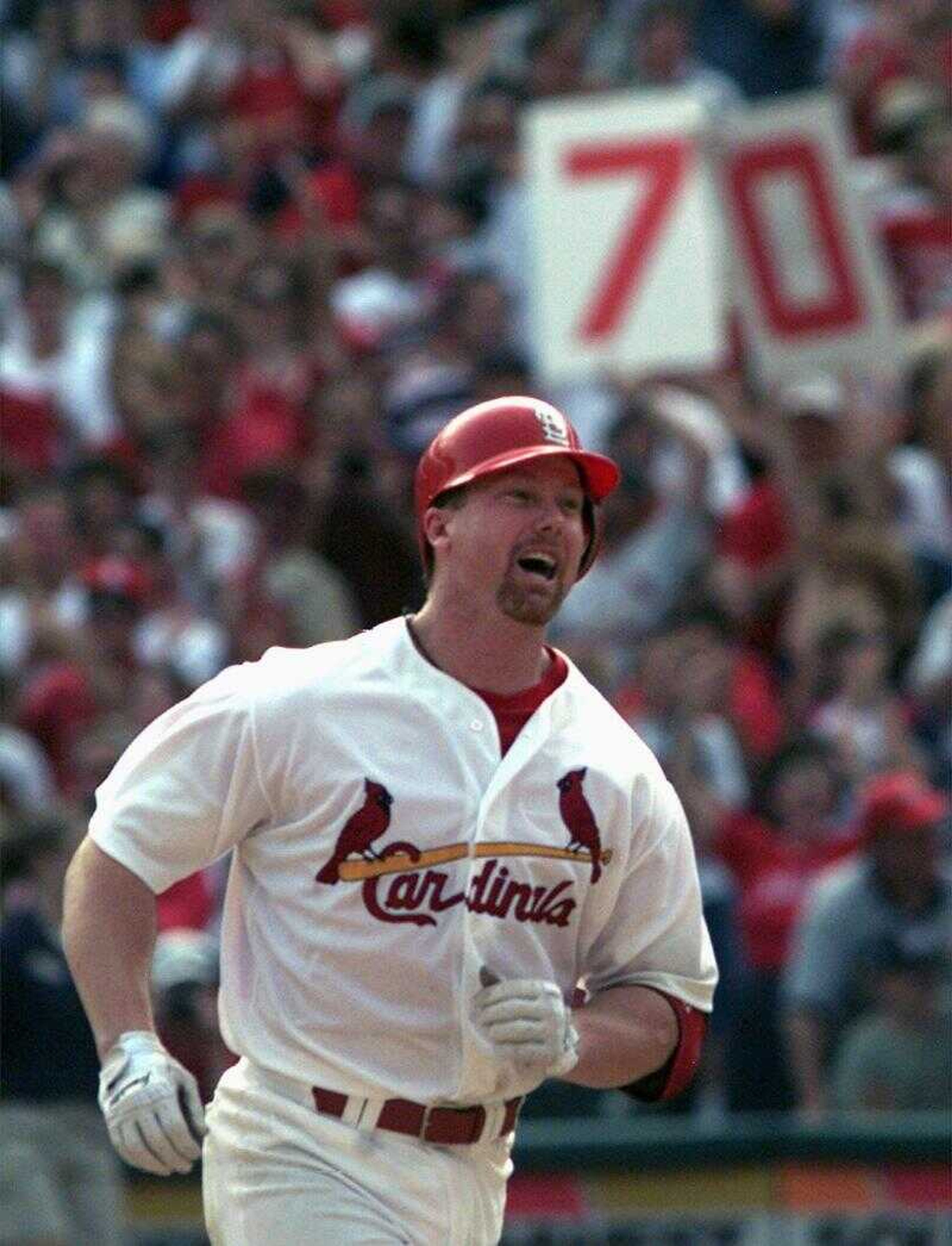 Former Cardinals slugger Mark McGwire rounded the bases after hitting his 70th and final home run of the 1998 season. (Associated Press file)