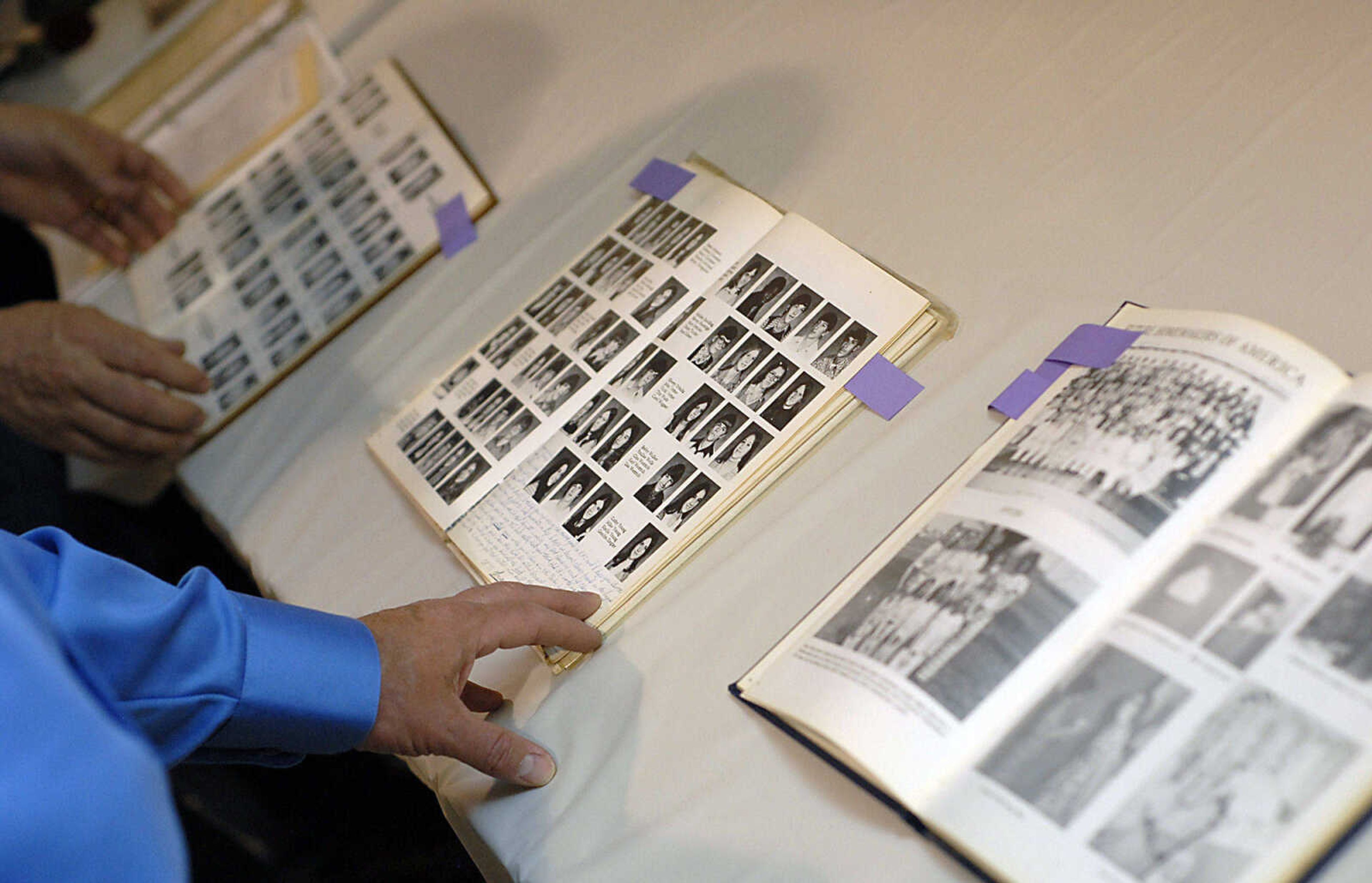 KIT DOYLE ~ kdoyle@semissourian.com
Guests look through photos of Cheryl Scherer during a reception Friday at St. Denis in Benton.