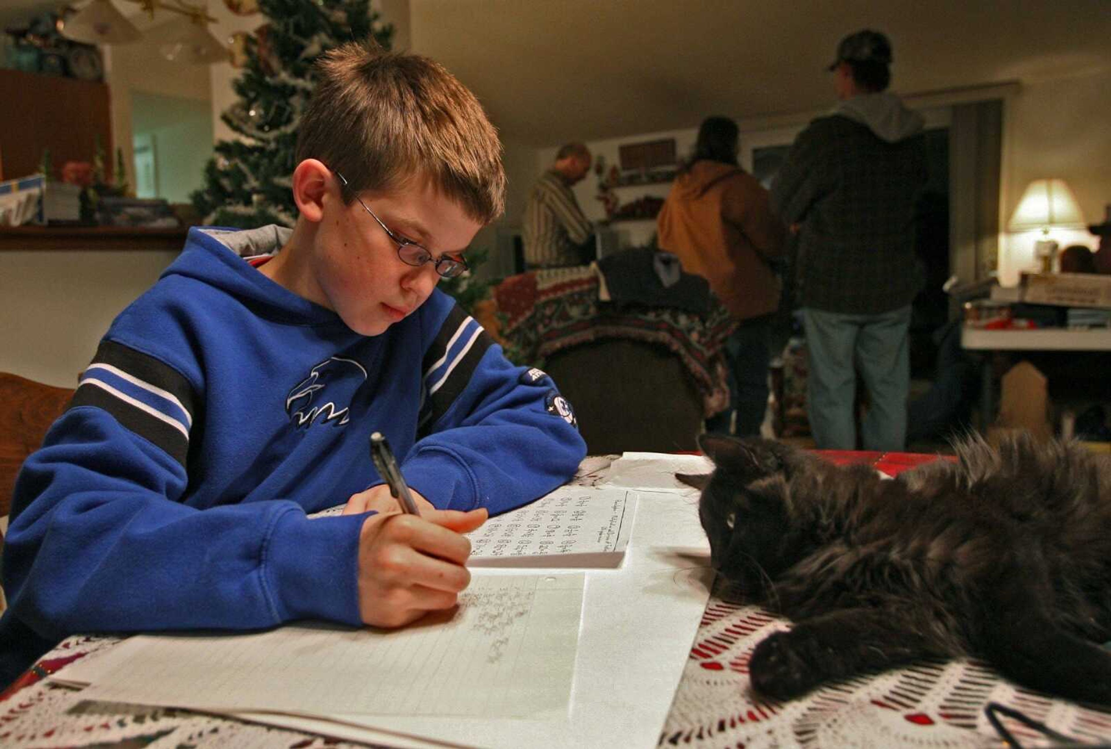 Ben Ownby does his homework at his home Jan. 20, 2007, in Beaufort, Missouri. Ben, then 13, was missing four days when he was found Jan. 12, 2007, along with Shawn Hornbeck, then 15, who had been kidnapped four years earlier by Michael Devlin of Kirkwood, Missouri.