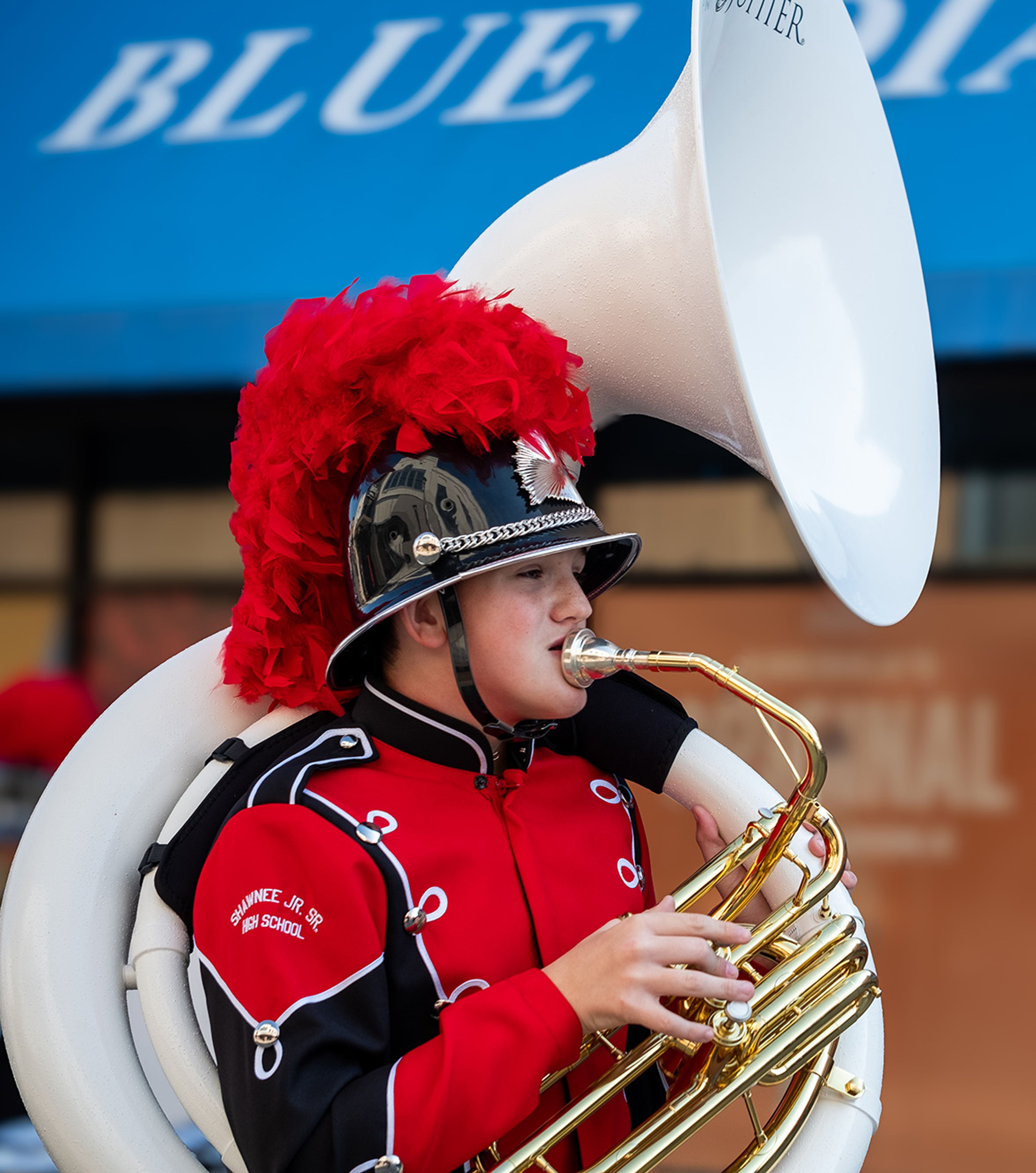 A Shawnee Jr./Sr. High School Marching Band tuba player marches in the parade.